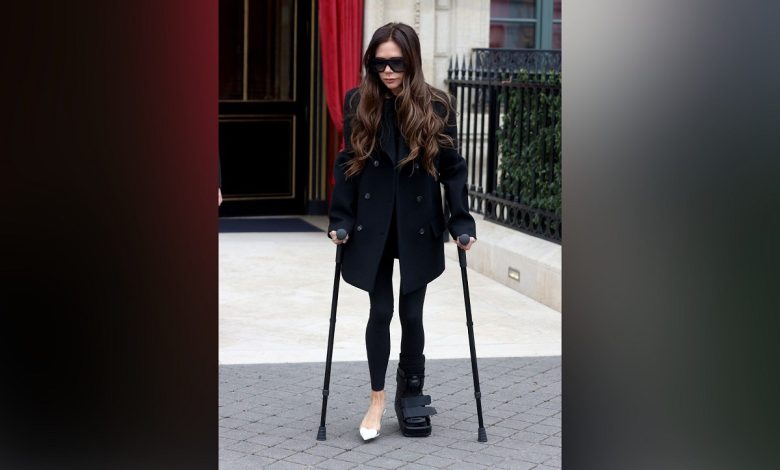 Victoria Beckham with crutches