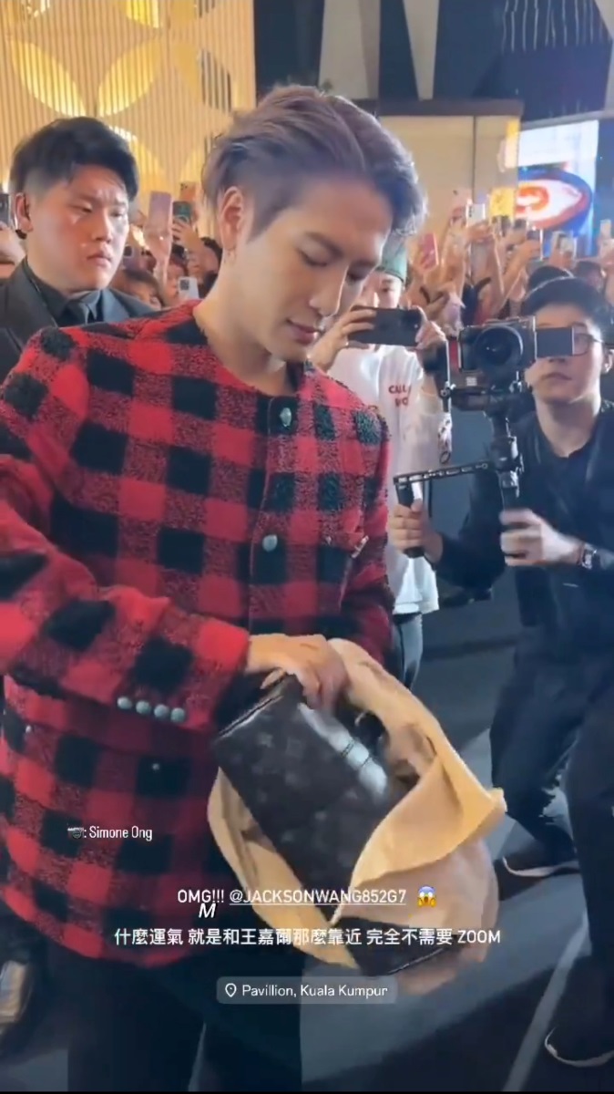 Jackson Wang Louis Vuitton bag and red plaid coat