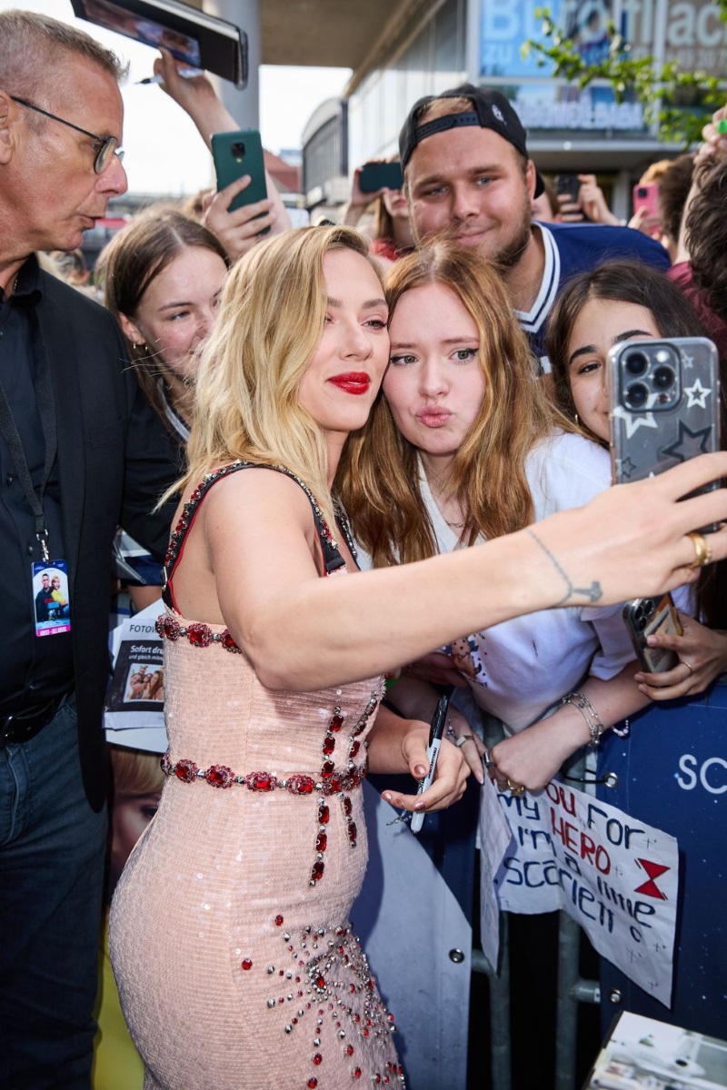 Scarlett Johansson in a baby dress and fans