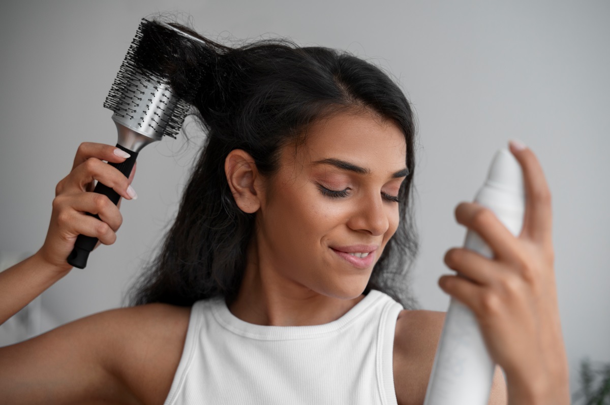 Styling hair with a hair dryer brush2