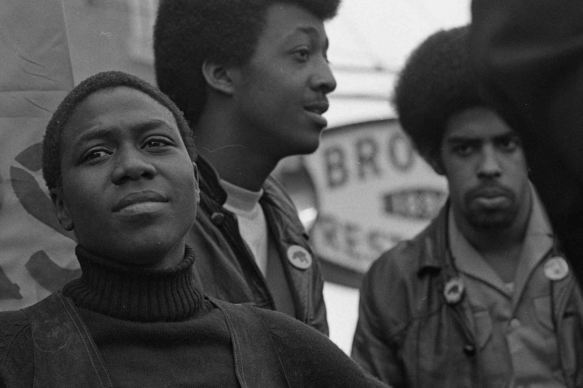 View of political & social activist and Black Panther member Afeni Shakur (fore), among others, onstage at a rally in support of the Panther 21, New York, New York, April 4, 1970. The Panther 21 were Black Panther members arrested by New York police under suspicion of planning a series of bombings, charges that were eventually dropped against all the defendants. (Photo by David Fenton/Getty Images)