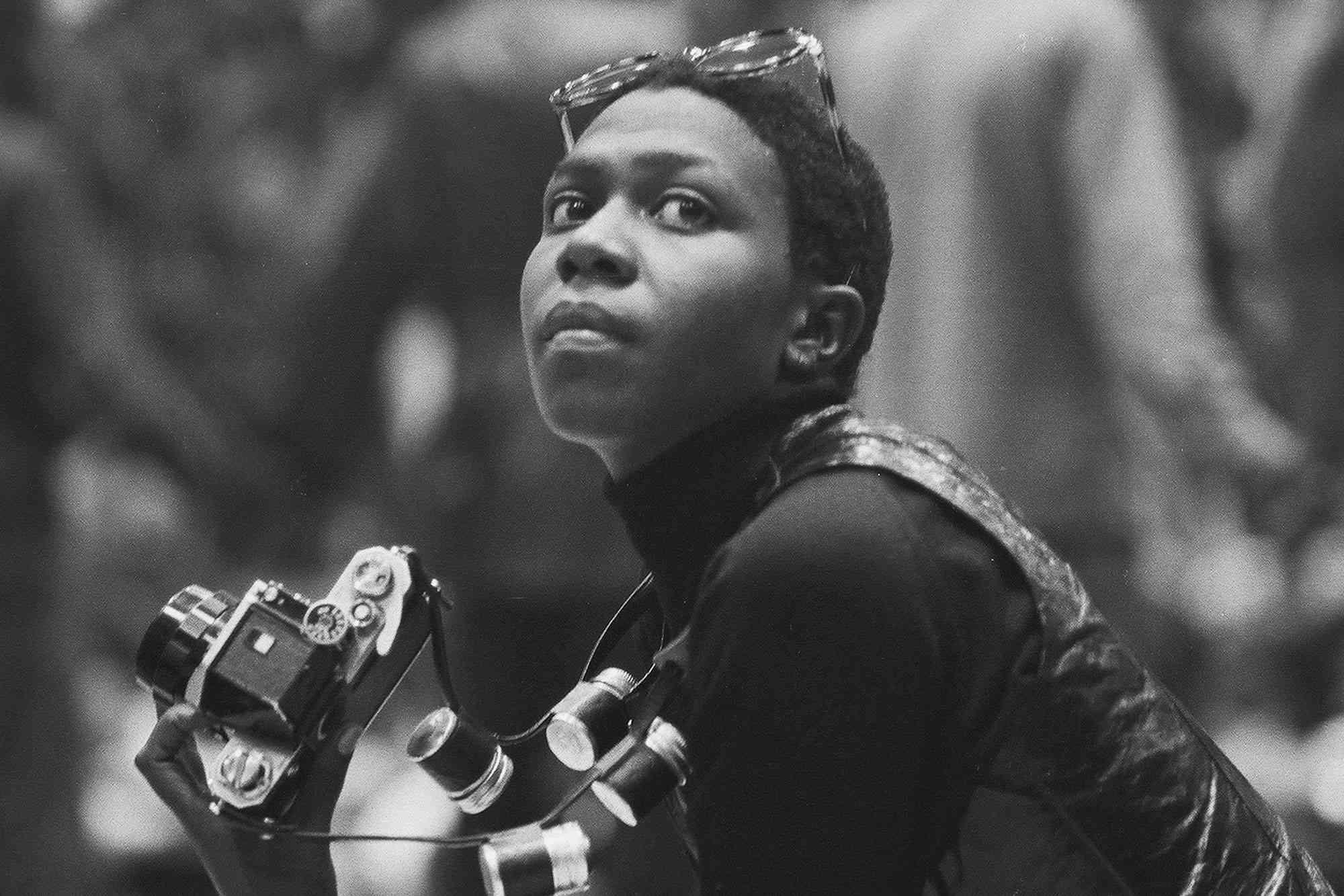 Political & social activist and Black Panther member Afeni Shakur (right) holds a camera as she attends a session of the Revolutionary People's Constitutional Convention, Philadelphia, Pennsylvania, between September 4 and 7, 1970. The convention was organized by the Black Panther Party to draft a new Constitution of the United States and unify factions of the radical left. (Photo by David Fenton/Getty Images)