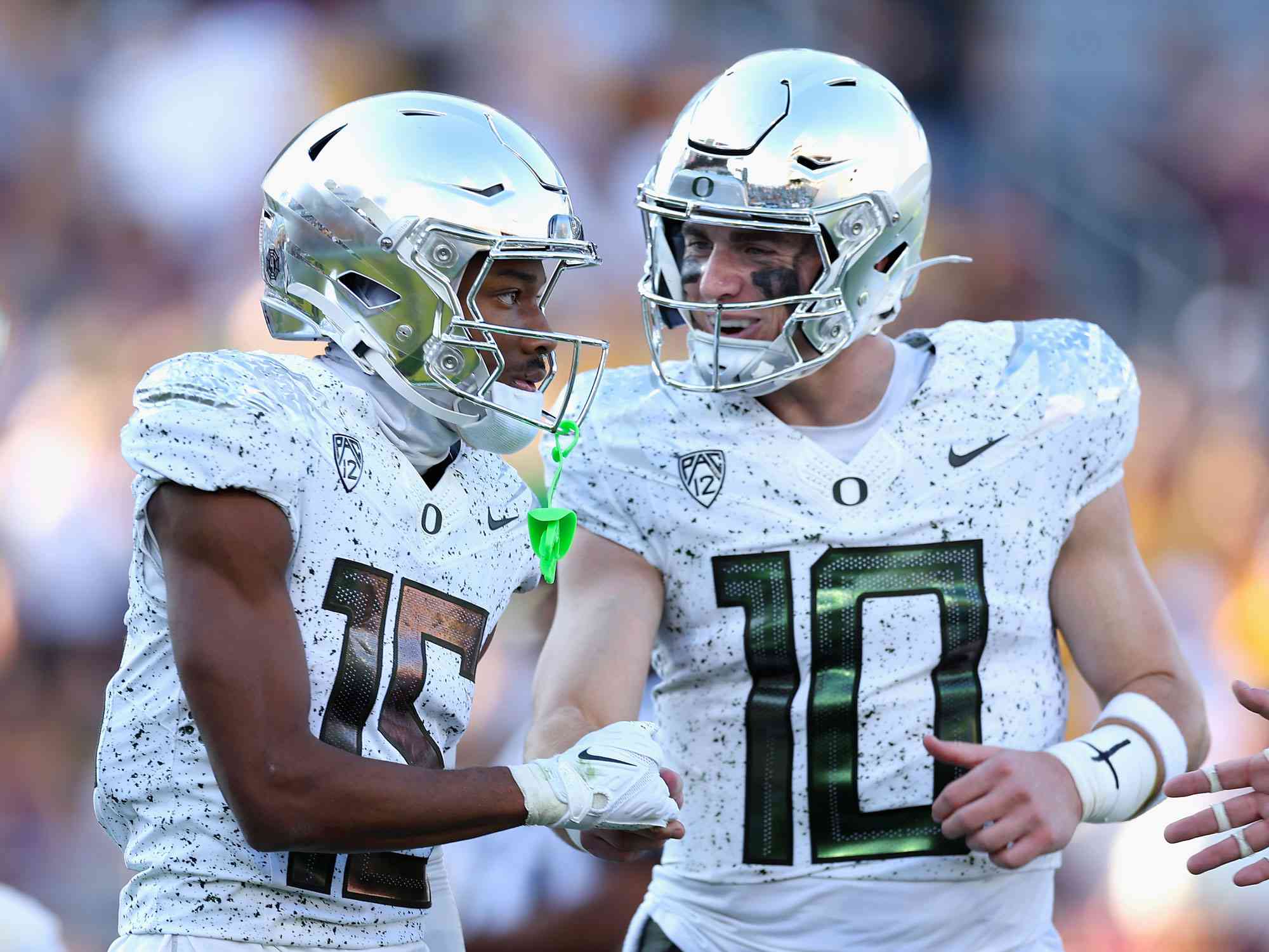 TEMPE, ARIZONA - NOVEMBER 18: Wide receiver Tez Johnson #15 of the Oregon Ducks celebrates with quarterback Bo Nix #10 after catching a 16-yard touchdown reception against the Arizona State Sun Devils during the first half of the NCAAF game at Mountain America Stadium on November 18, 2023 in Tempe, Arizona. (Photo by Christian Petersen/Getty Images)