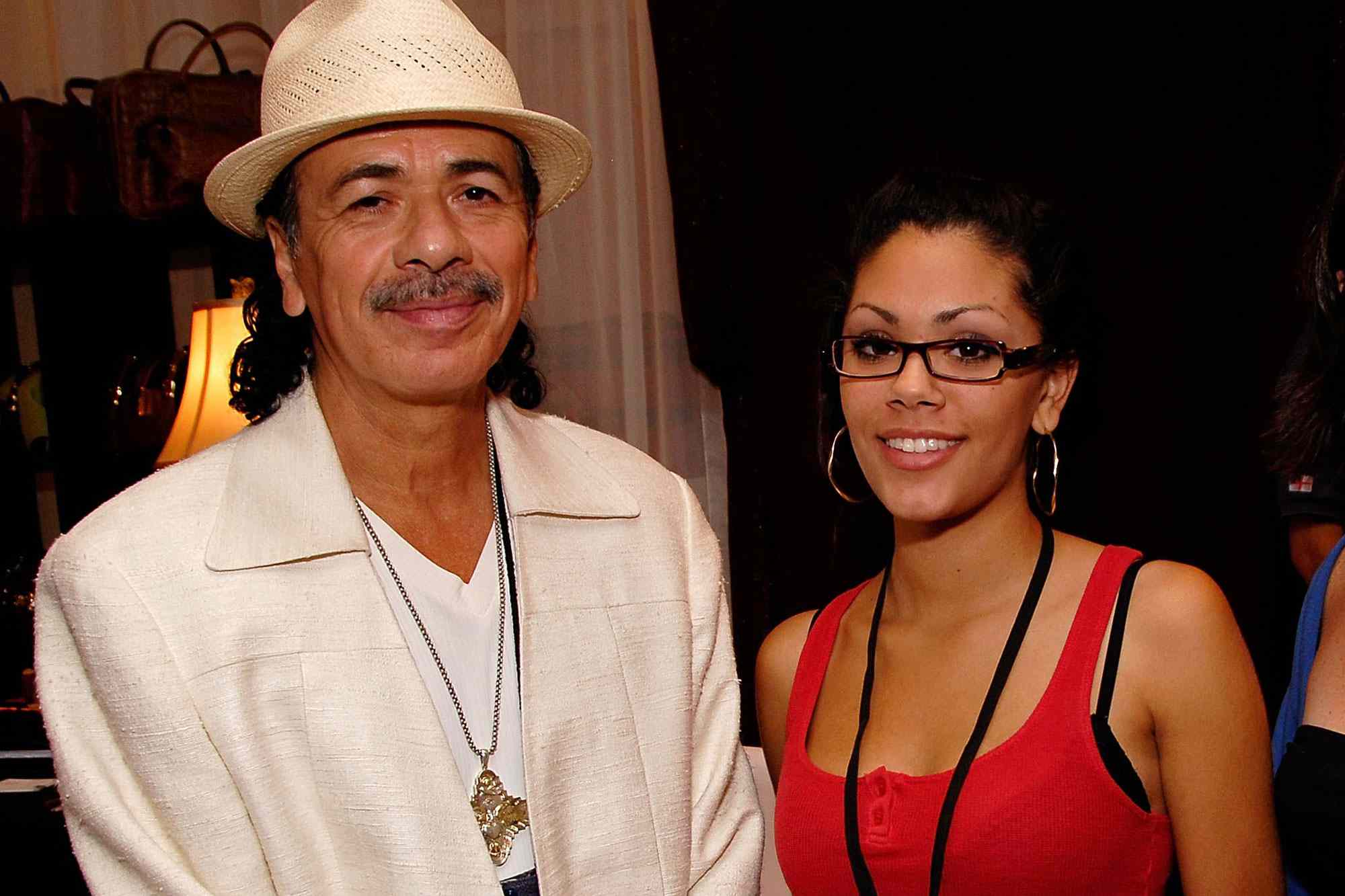 LAS VEGAS - OCTOBER 06: Musician Carlos Santana, daughter Angelica Santana, and designer Meg Reagan of '9 Manning Square' pose at the Distinctive Assets Gift Lounge held during Andre Agassi's 12th Annual Grand Slam for Children at the MGM Grand Garden Arena on October 6, 2007 in Las Vegas, Nevada. (Photo by Charley Gallay/Getty Images for Distinctive Assets)