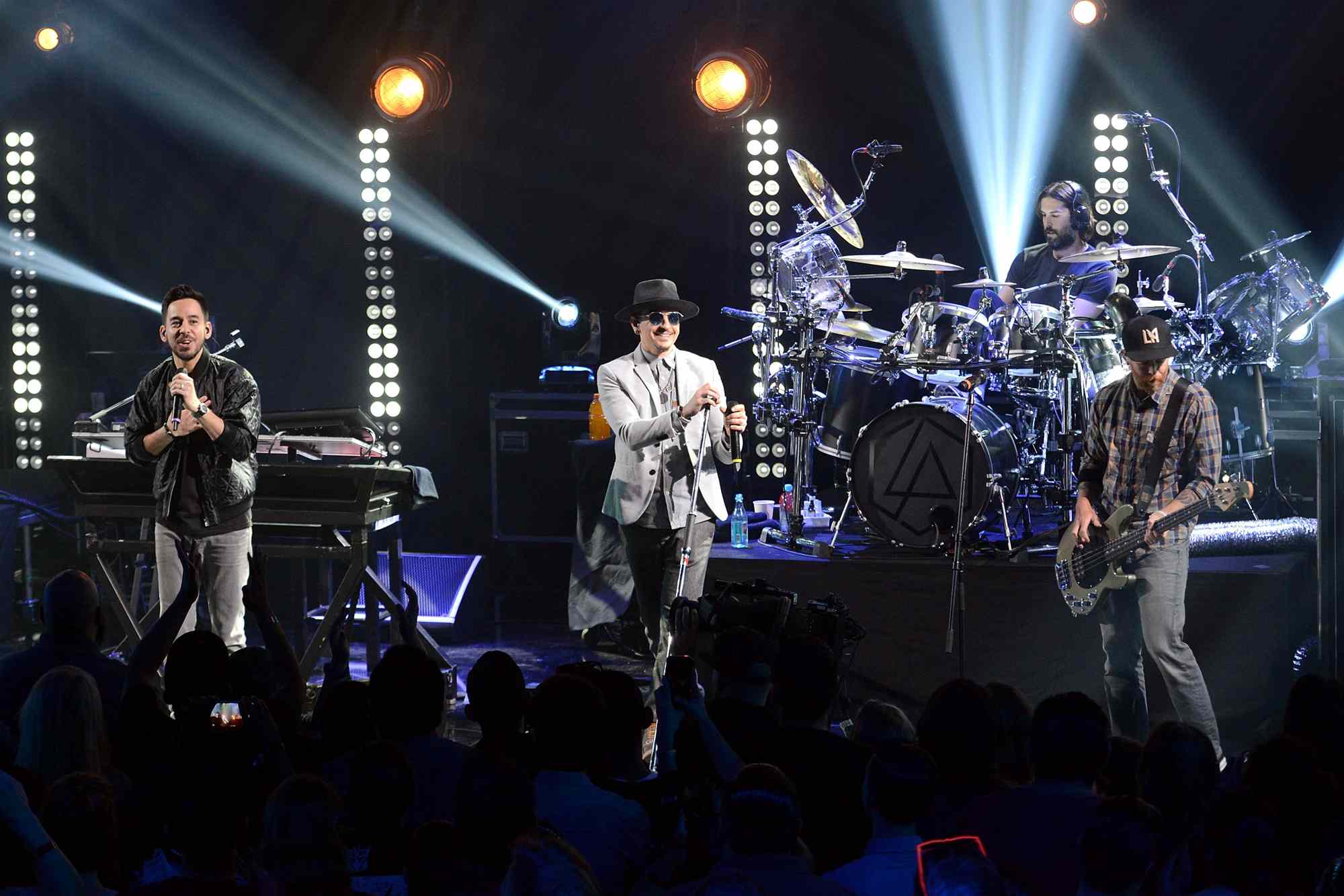 Musicians Mike Shinoda, Chester Bennington, Rob Bourdon and Dave Farrell of Linkin Park perform onstage