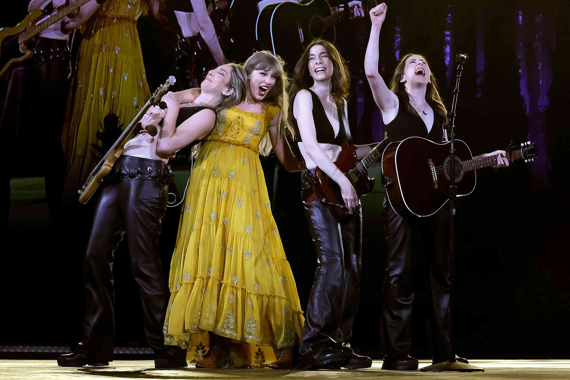 INGLEWOOD, CALIFORNIA - AUGUST 09: EDITORIAL USE ONLY. NO BOOK COVERS. (L-R) Este Haim, Taylor Swift, Danielle Haim and Alana Haim perform onstage during "Taylor Swift | The Eras Tour" at SoFi Stadium on August 09, 2023 in Inglewood, California. 