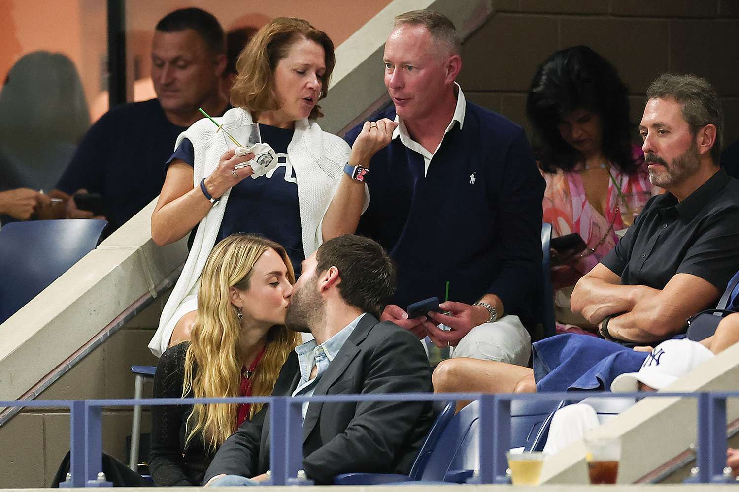 Grace Van Patten and Jackson White share a kiss at the 2024 US Open on Saturday, Aug. 31, 2024 in Flushing, NY.