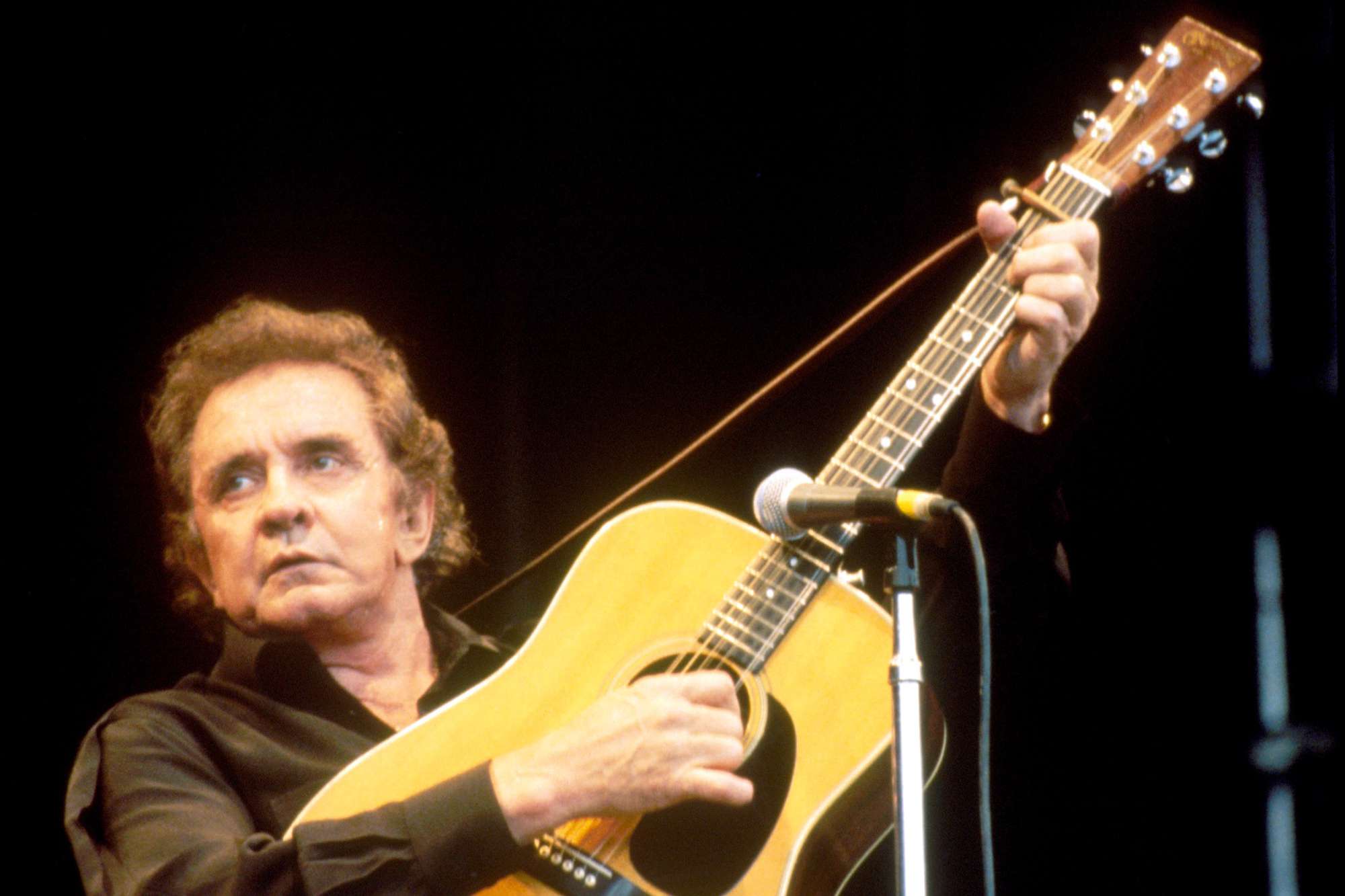 Johnny Cash performs on stage at Glastonbury Festival,