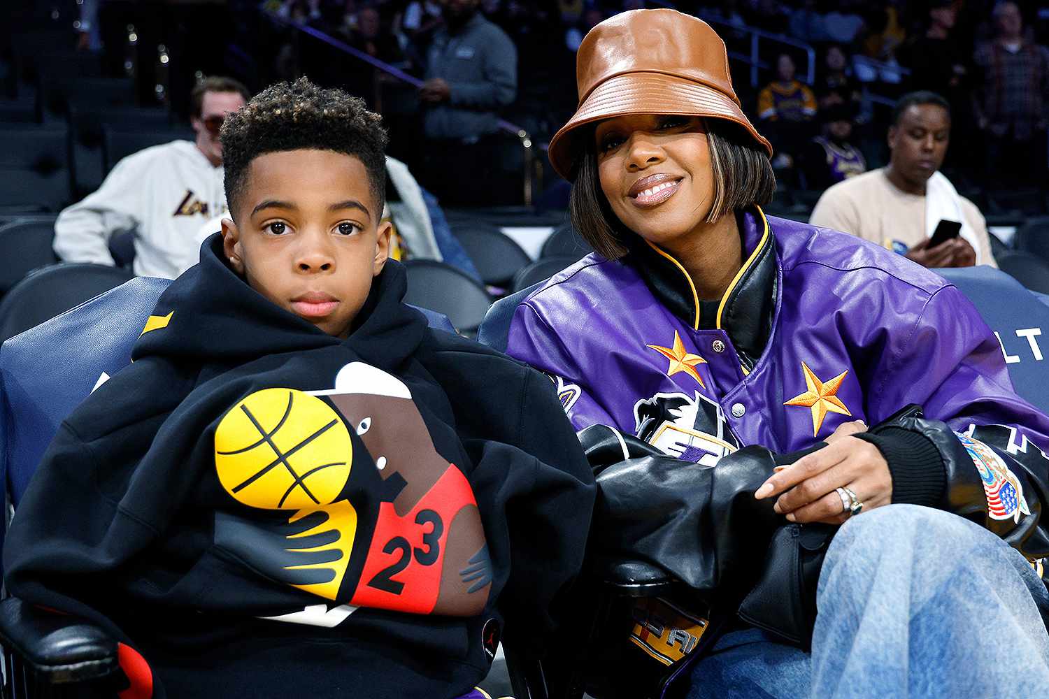 Kelly Rowland and her son Titan Weatherspoon attend the basketball game between the Los Angeles Lakers and the New Orleans Pelicans