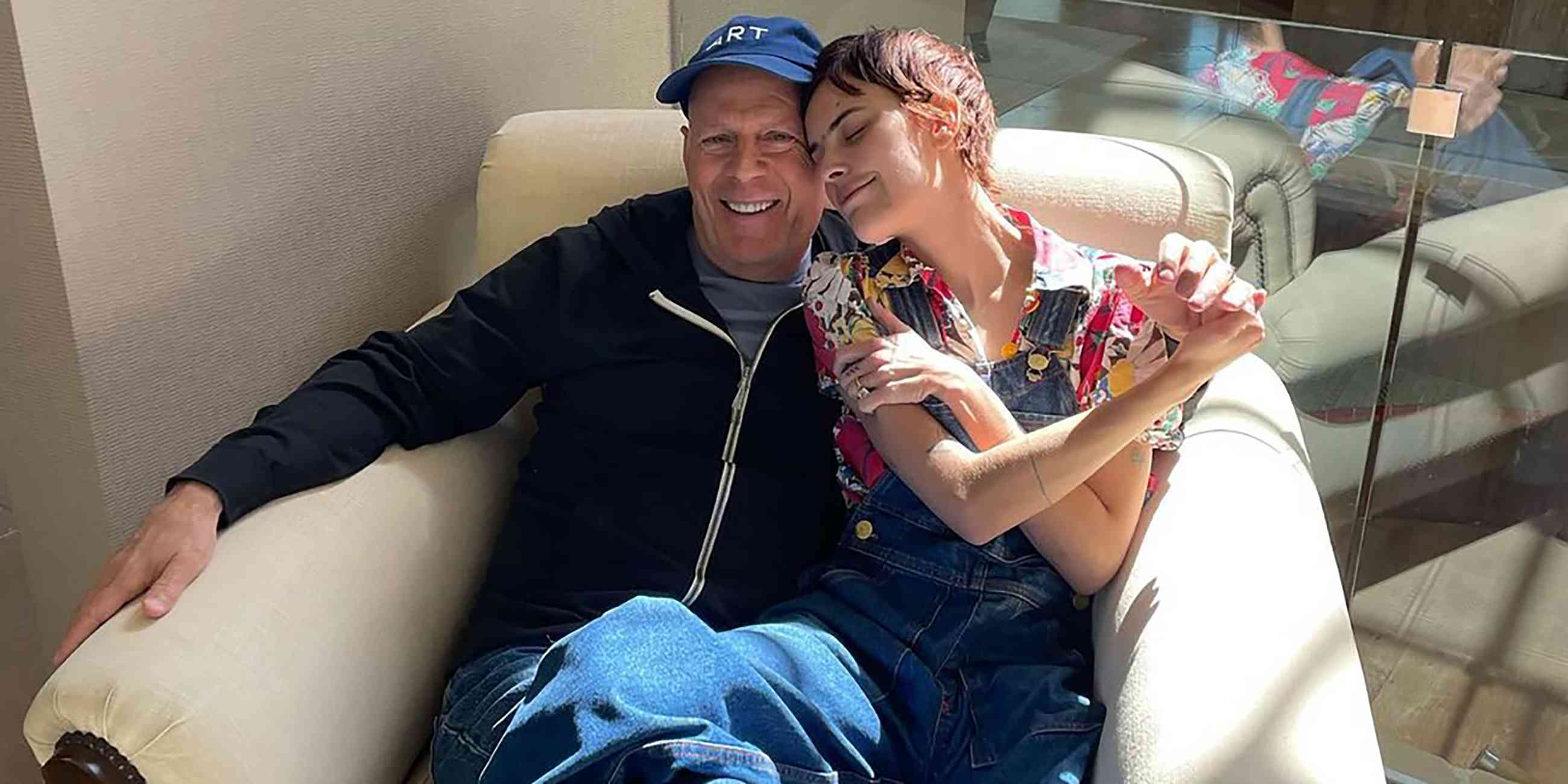 Bruce and Tallulah Willis Sitting in Chair Together Smiling and Holding Hands