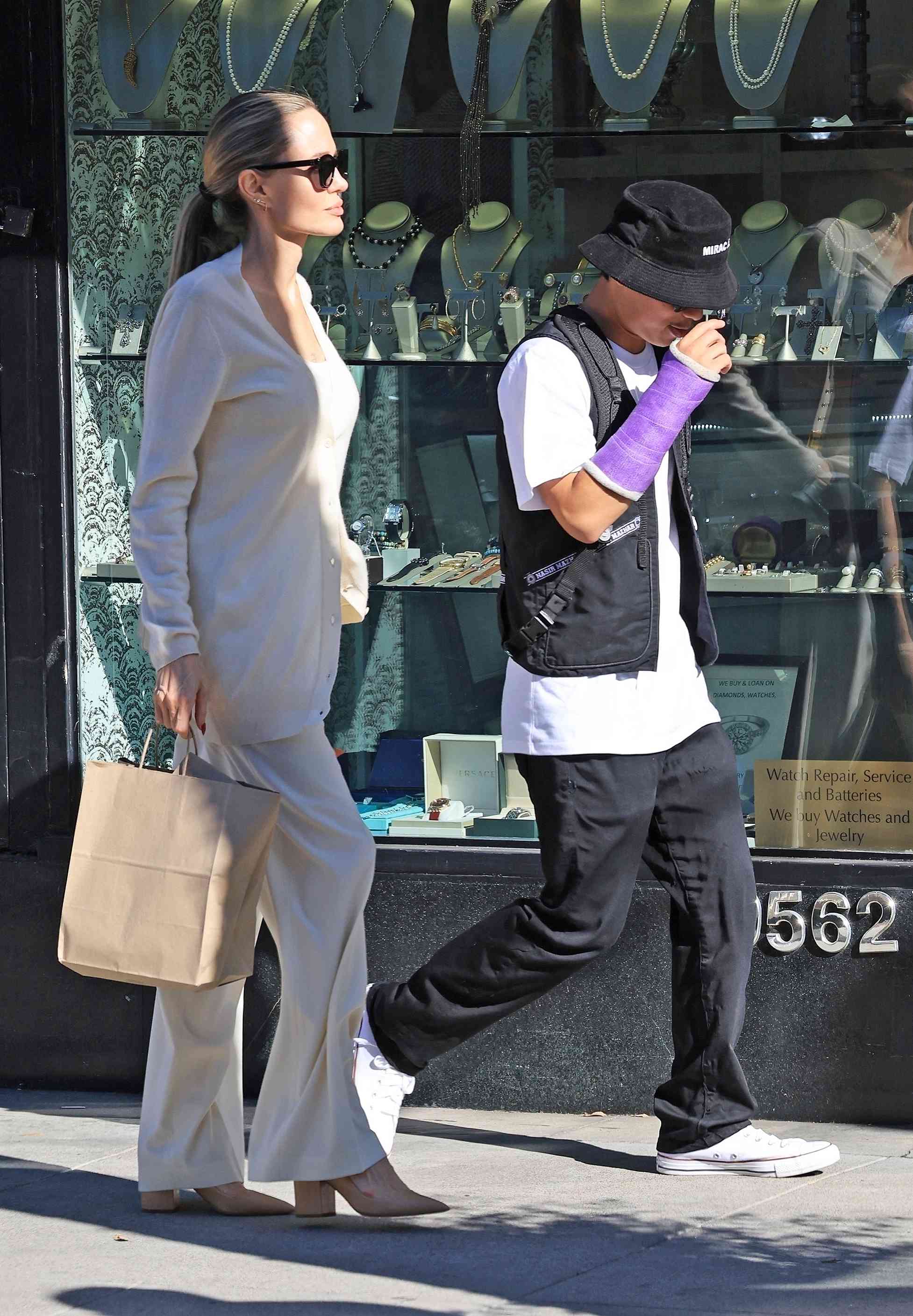 Pax Thien Jolie-Pitt is seen for the first time grabbing lunch with Angelina Jolie after his e-bike accident in Beverly Hills.