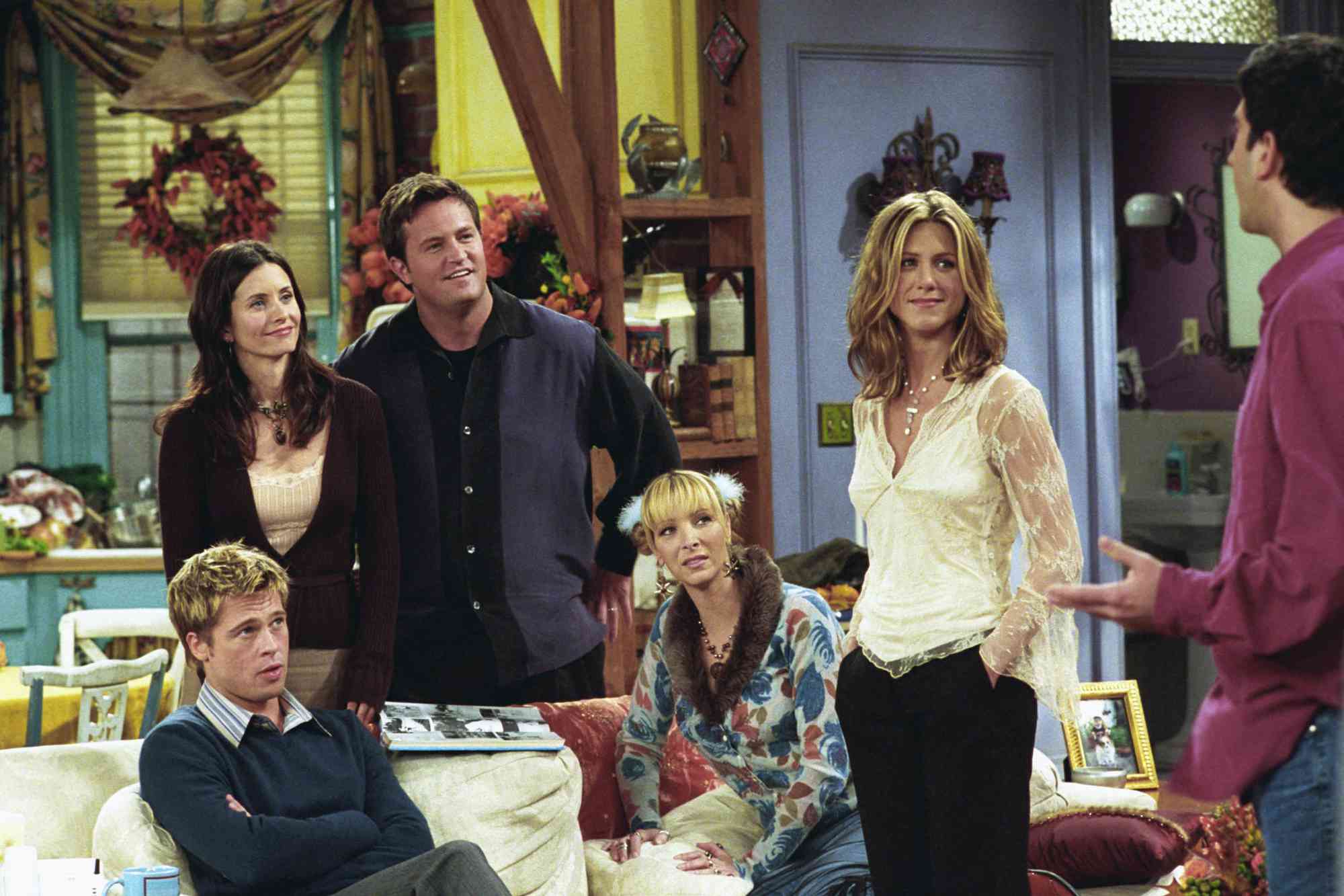 Brad Pitt (seated, left) guest stars on the 'Friends' episode 'The One with the Rumor' on Nov. 22, 2001