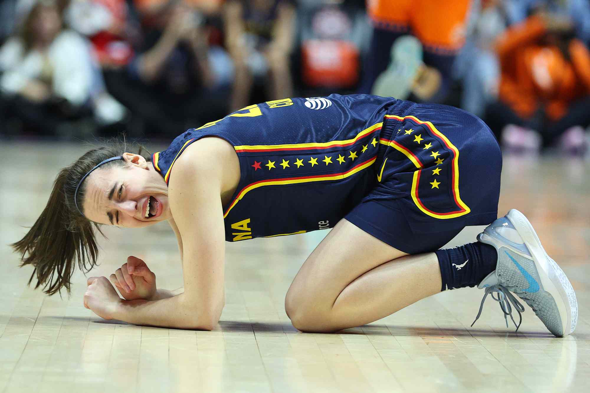 Indiana Fever guard Caitlin Clark (22) reacts after getting hit in the eye during the First Round and game 1 of the 2024 WNBA playoffs between Indiana Fever and Connecticut Sun on September 22, 2024, at Mohegan Sun Arena in Uncasville, CT. 