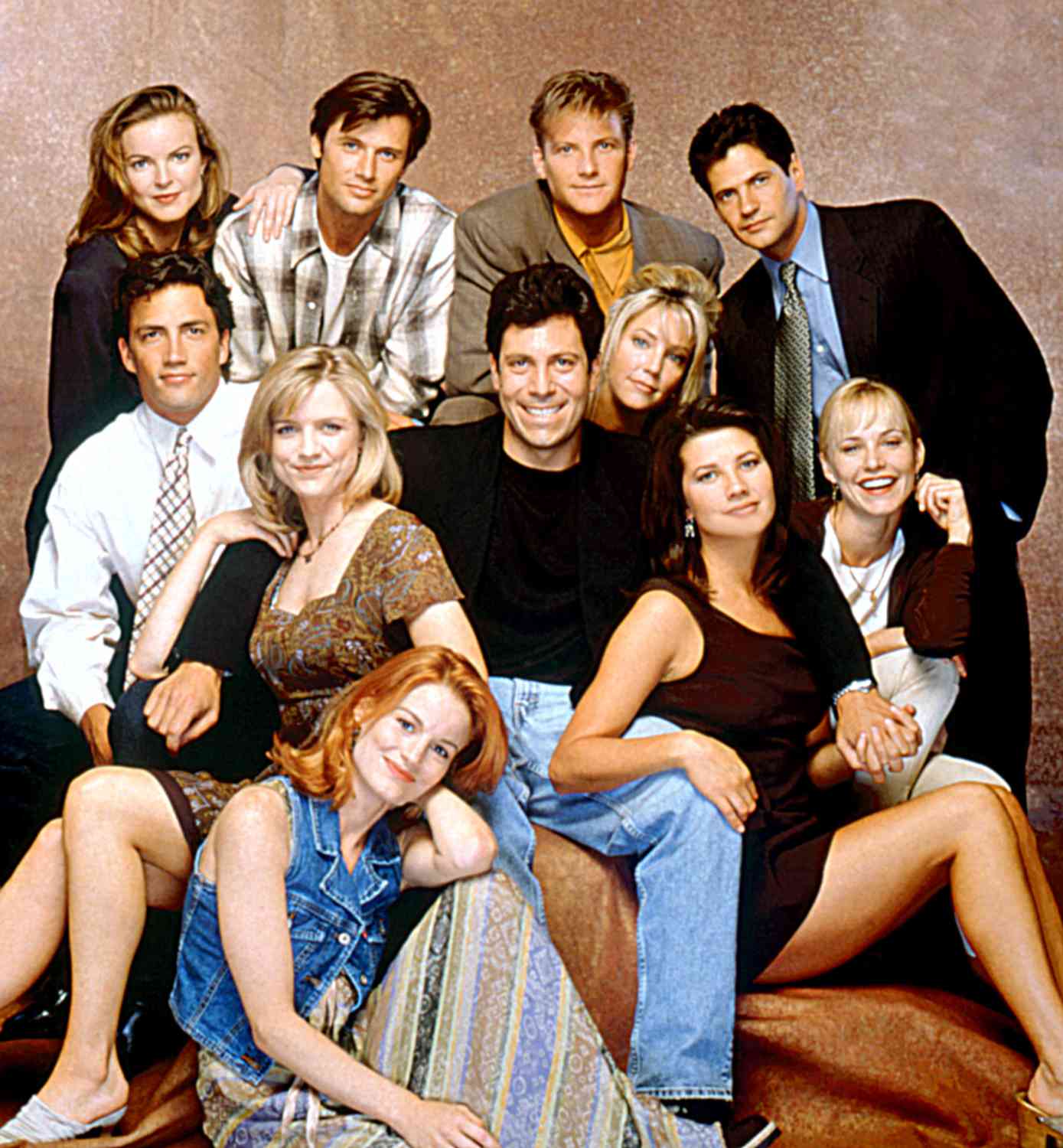 MELROSE PLACE, (Back Row, L-R:), Marcia Cross, Grant Show, Doug Savant, Thomas Calabro.(Seated, L-R:), Andrew Shue, Courtney Thorne-Smith, Laura Leighton, (Writer/Producer), Darren Star Daphne Zuniga, Josie Bissett, 1994.