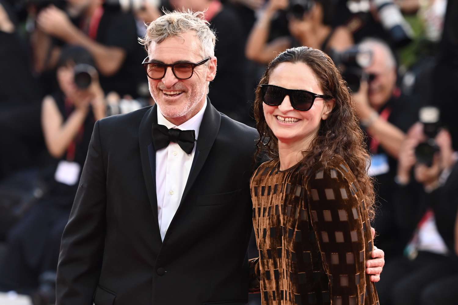 Joaquin Phoenix and his sister Rain Phoenix attend the premiere of the film "Joker: Folie Ã  Deux" at the 81st Venice International Film