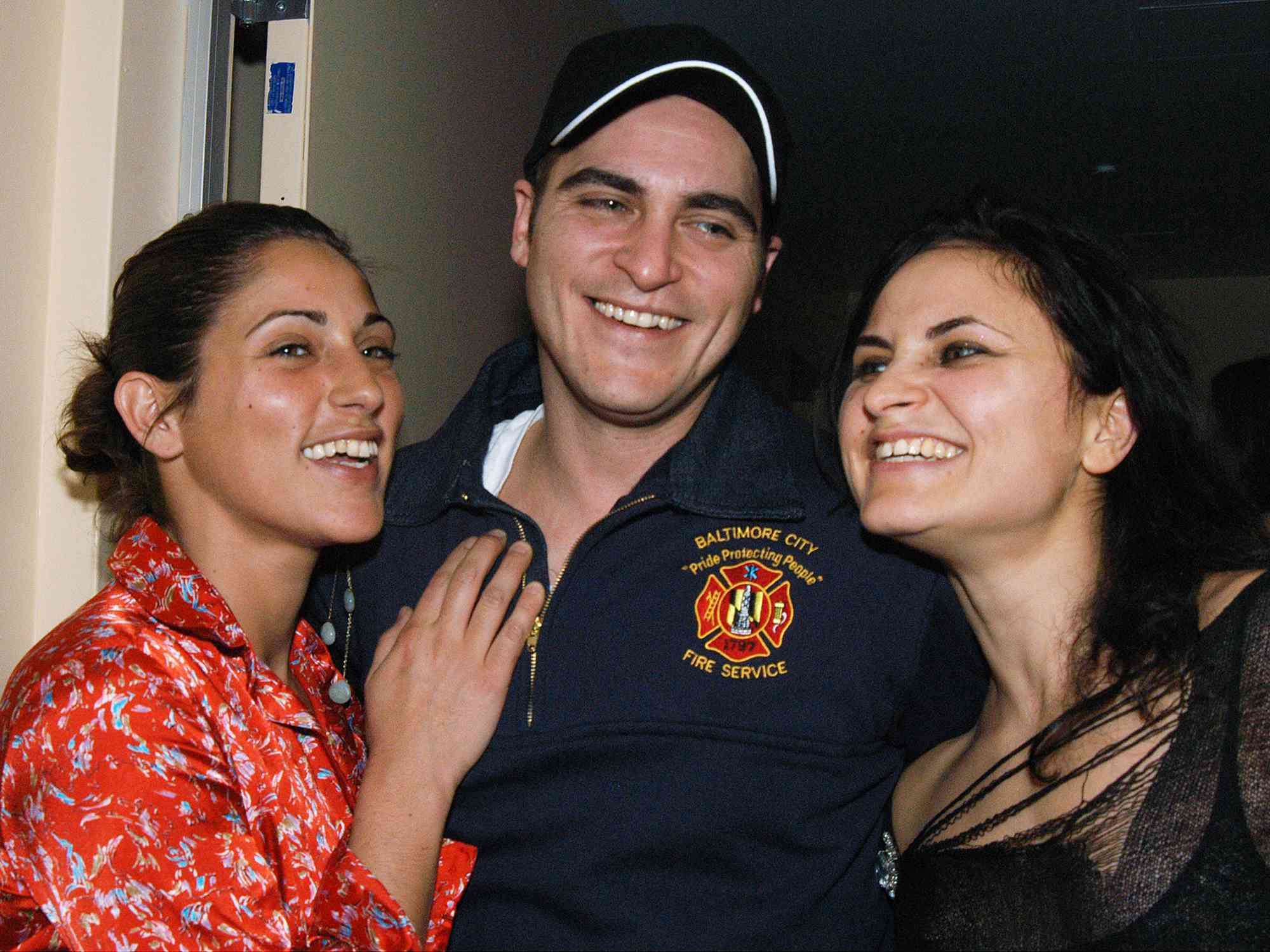 Joaquin Phoenix with his sisters Summer and Rain during the Om Yoga Center's grand opening celebration and benefit for the Tibetan Handicapped Children's Fund.