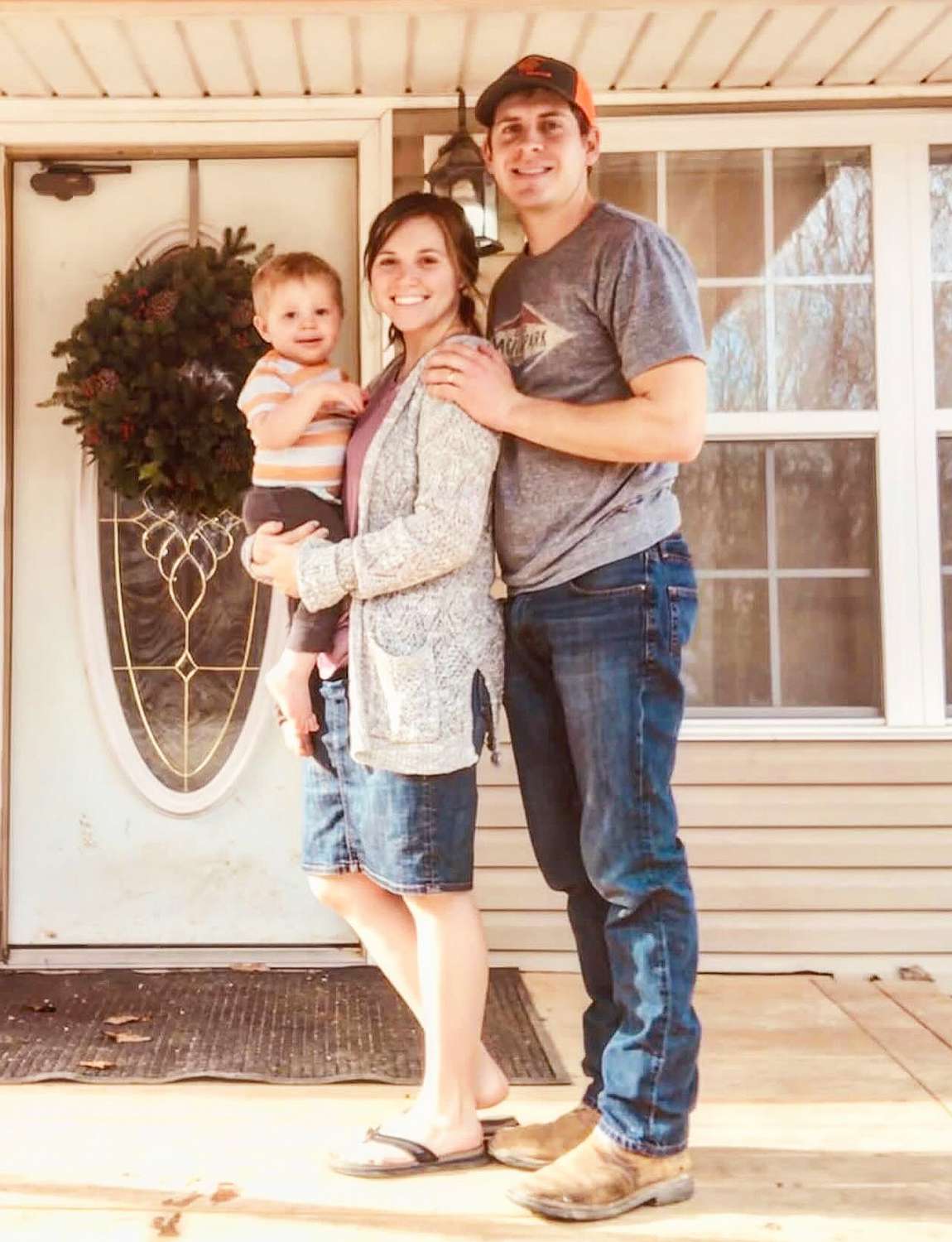 Joy Anna Duggar poses with family in old house