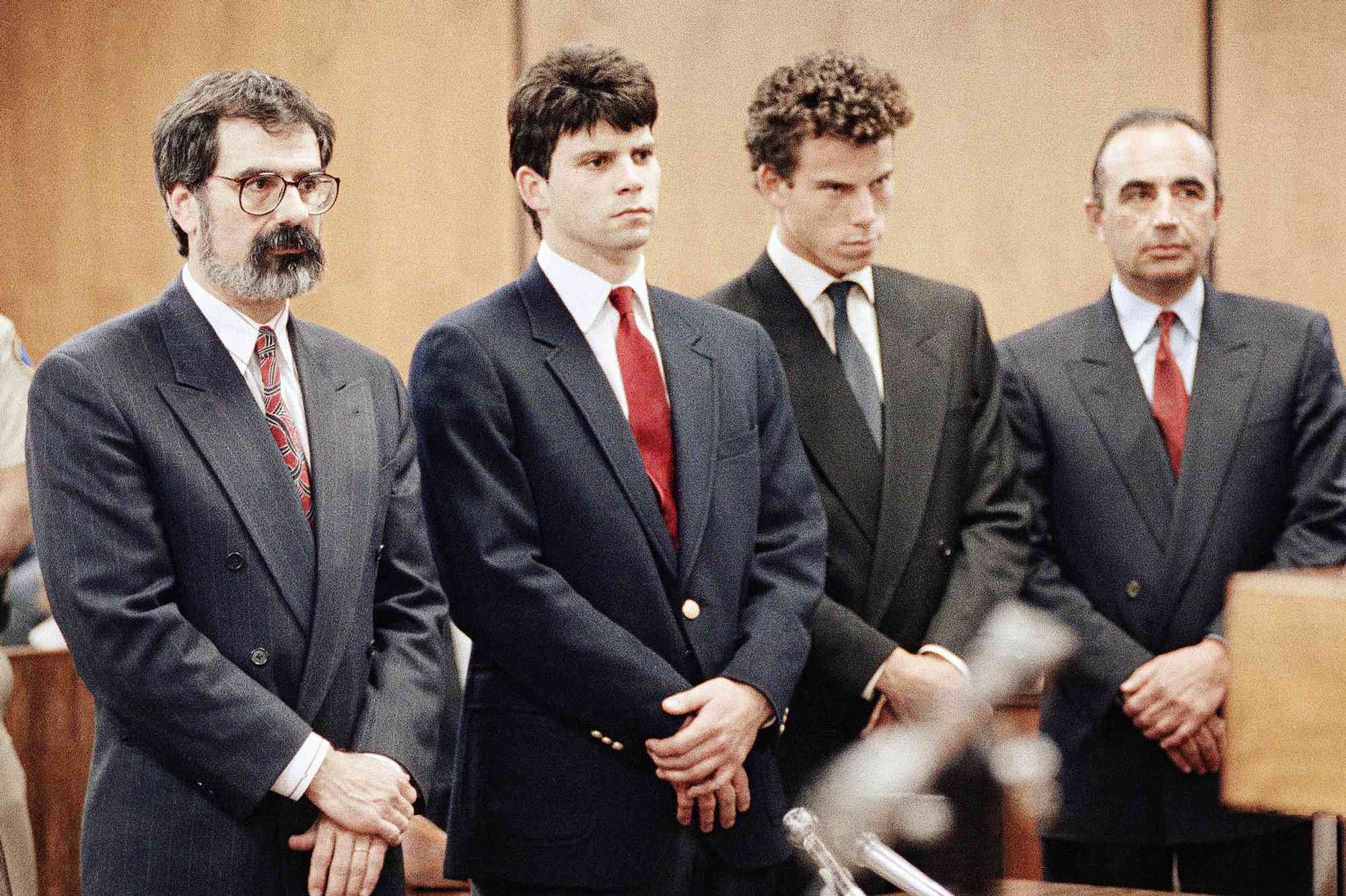 Lyle Menendez, second from left, and his brother, Erik, second from right, are flanked by their attorneys Gerald Chaleff, left, and Robert Shapiro, as the brothers delayed entering pleas through their attorneys in Beverly Hills Municipal Court, March 13, 1990. The brothers are suspected in the murders of their millionaire parents, Jose and Mary Louise Kitty Menendez, in Beverly Hills, California in August.