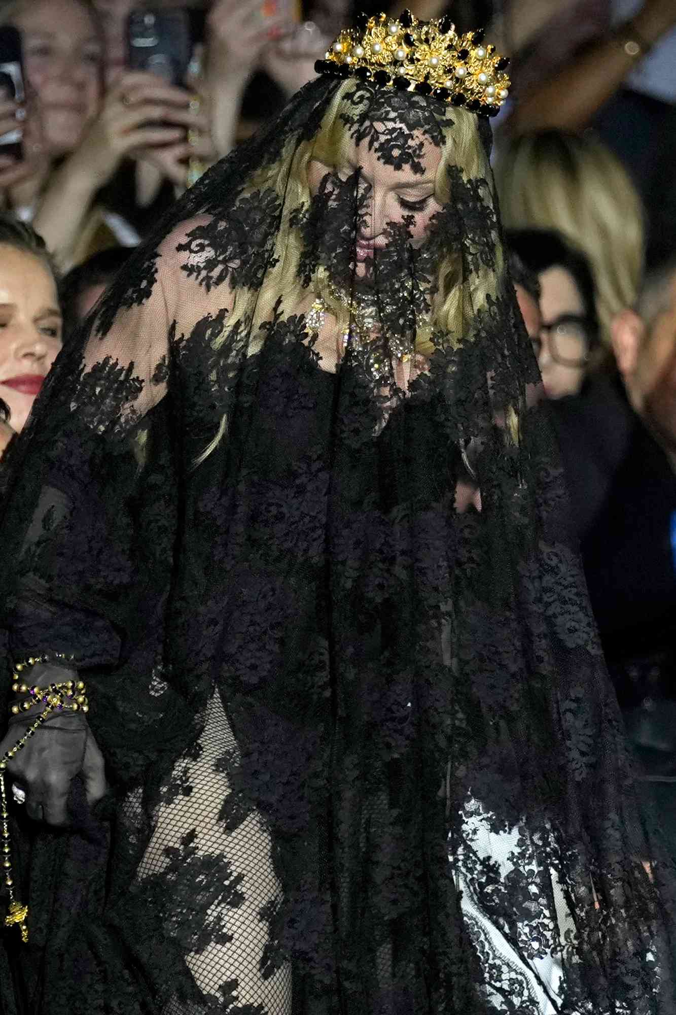 Madonna stands at the end of the Dolce & Gabbana Spring Summer 2025 fashion show, that was presented in Milan, Italy, Saturday, Sept. 21, 2024.