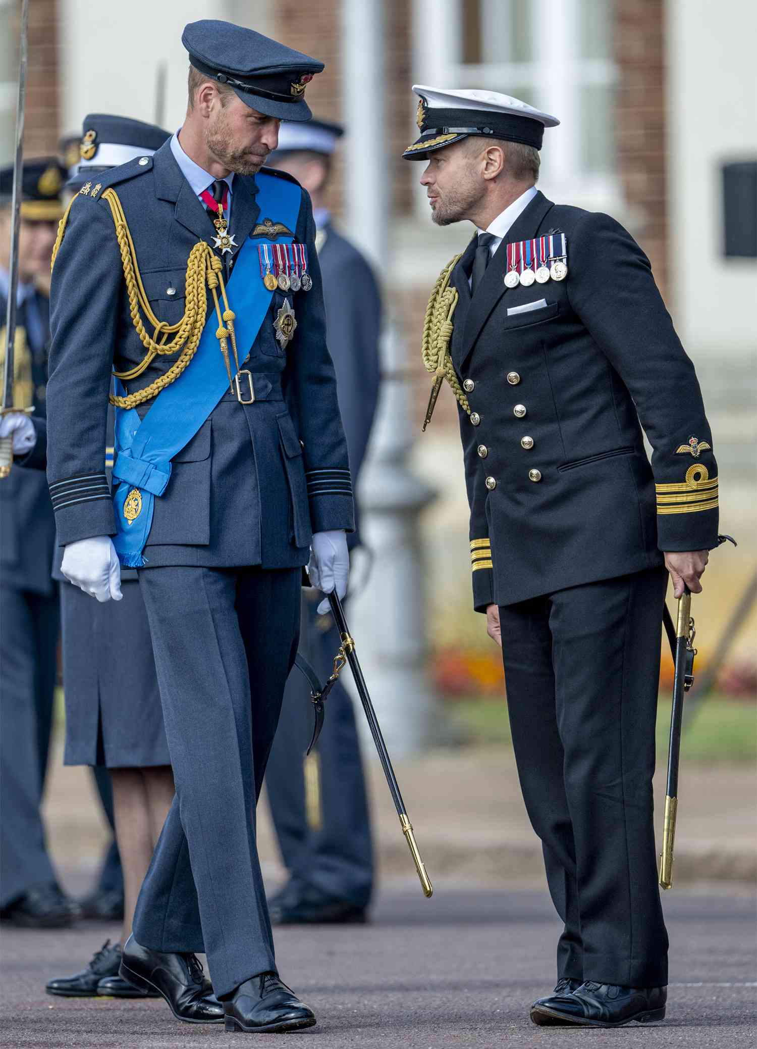 Prince William, Prince of Wales with Commander Rob Dixon (Equerry to Prince William, Prince of Wales and Catherine, Princess of Wales) attend the Sovereign's Parade on behalf of King Charles III at the Royal Air Force College in Cranwell