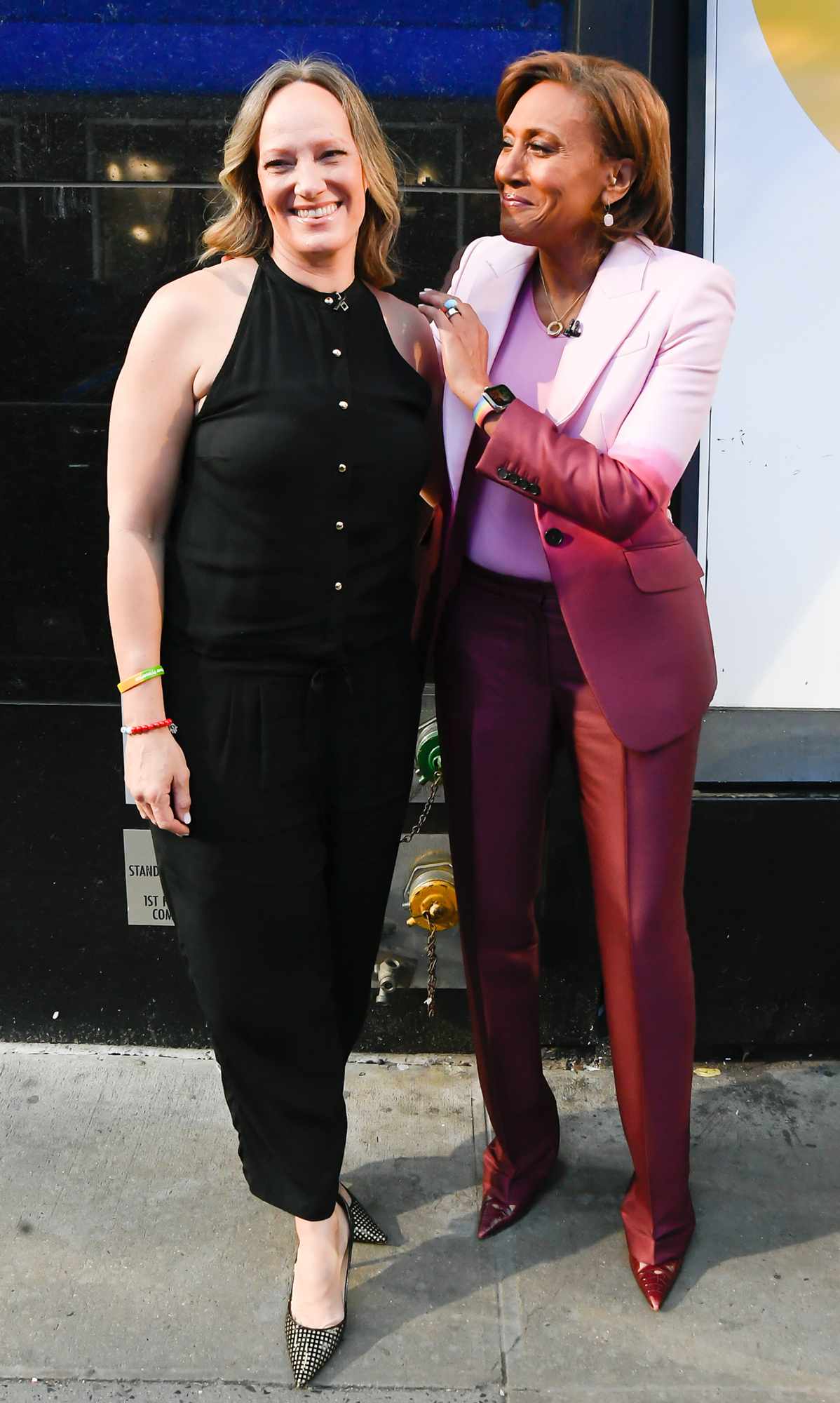 Amber Laign and Robin Roberts celebrate Robin Roberts' 20th "GMA" anniversary outside "Good Morning America" on April 14, 2022 in New York City