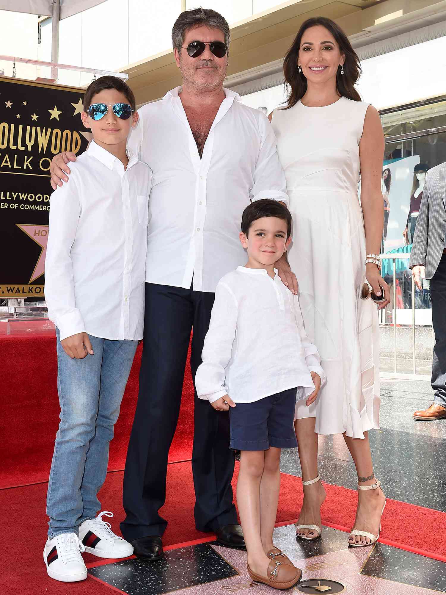 Simon Cowell, Lauren Silverman, Eric Cowell and Adam Silverman attend the ceremony honoring Simon Cowell with star on the Hollywood Walk of Fame in 2018