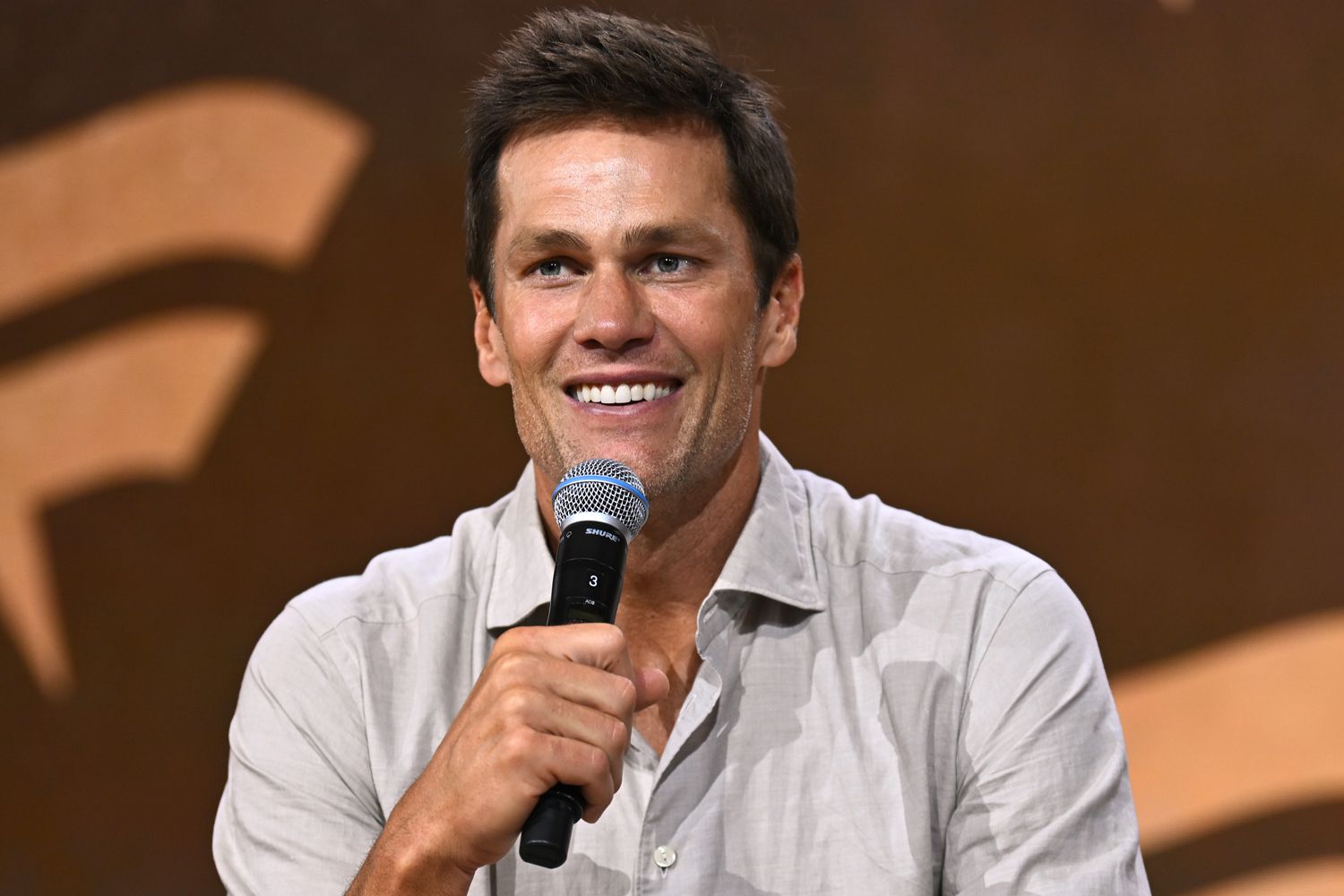 Tom Brady speaks at the Fanatics Fest NYC 2024 at Jacob Javits Center on August 16, 2024 in New York City. 