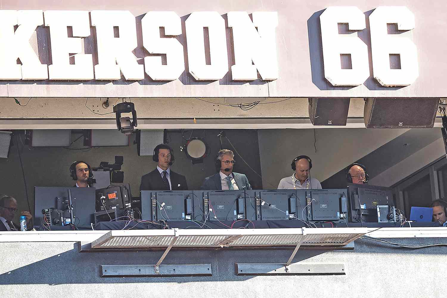 Fox Sports football analyst Tom Brady (second from left) and play-by-play broadcaster Kevin Burkhardt (third from left) announce during the second half of an NFL football game between the Dallas Cowboys against the Cleveland Browns