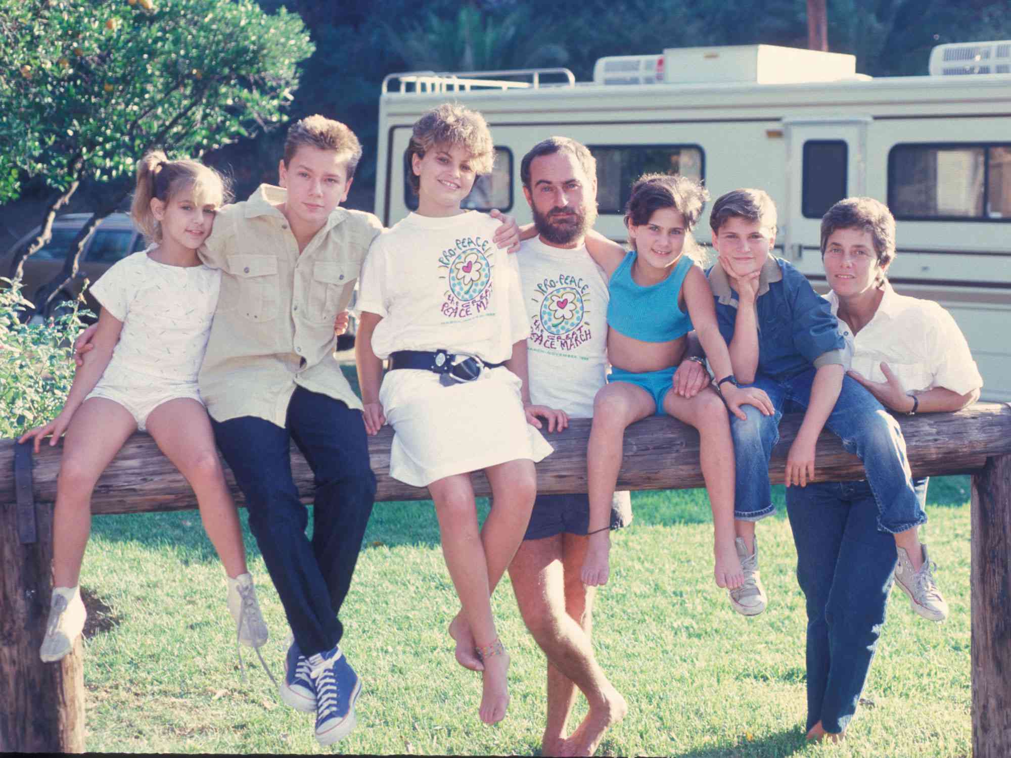 The Phoenix Family next to the RV they travel in when they do missionary work, at their home in Los Angeles, California, US, circa 1986; L-R Summer Phoenix, River Phoenix, Liberty Phoenix, John Lee Phoenix, Rain Phoenix, Joaquin Phoenix, Arlyn Phoenix. (Photo by Dianna Whitley/Getty Images)