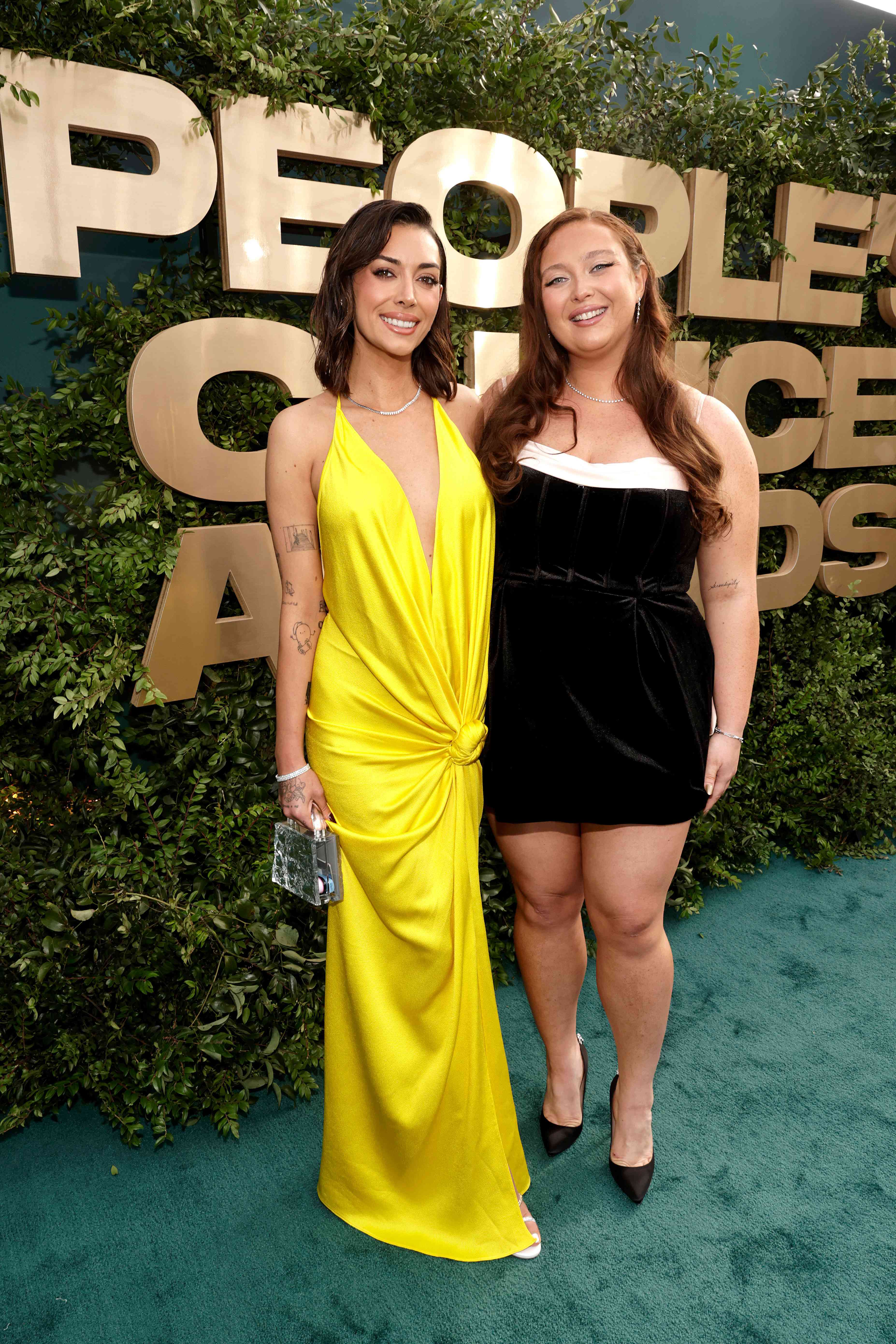 Brianna Chickenfry and Grace OâMalley arrive to the 2024 People's Choice Awards held at Barker Hangar on February 18, 2024 in Santa Monica, California.