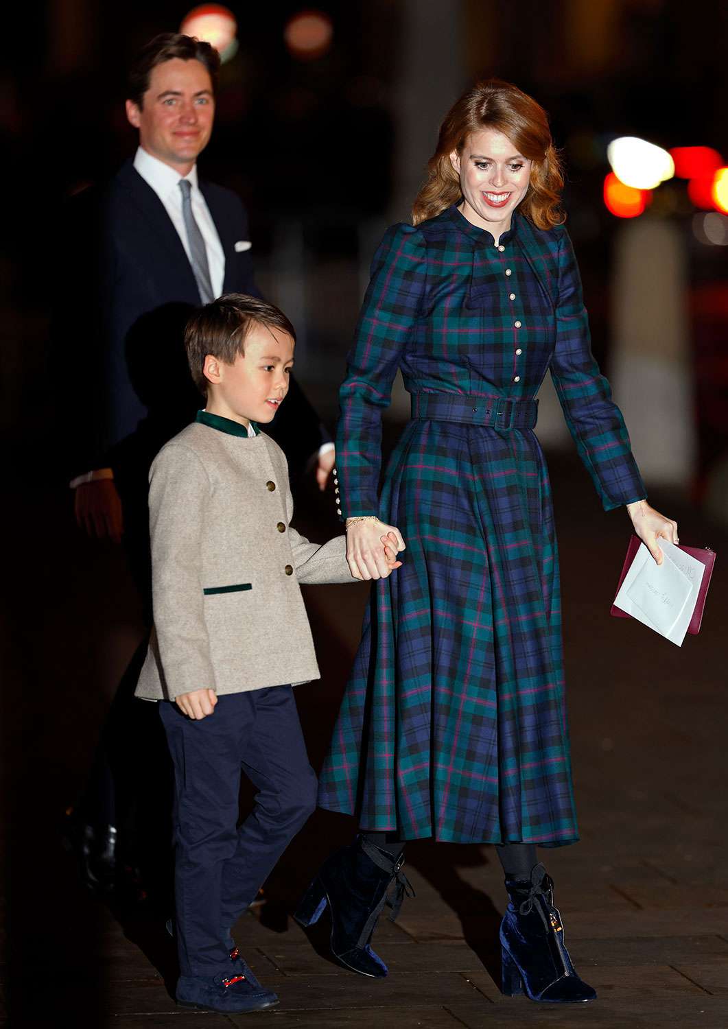 Edoardo Mapelli Mozzi, Christopher Woolf Mapelli Mozzi and Princess Beatrice attend The 'Together At Christmas' Carol Service at Westminster Abbey on December 8, 2023 in London, England. Spearheaded by The Princess of Wales, linked to her Shaping Us campaign and supported by The Royal Foundation, the service is a moment to bring people together at Christmas time and recognise those who have gone above and beyond to help others throughout the year. 