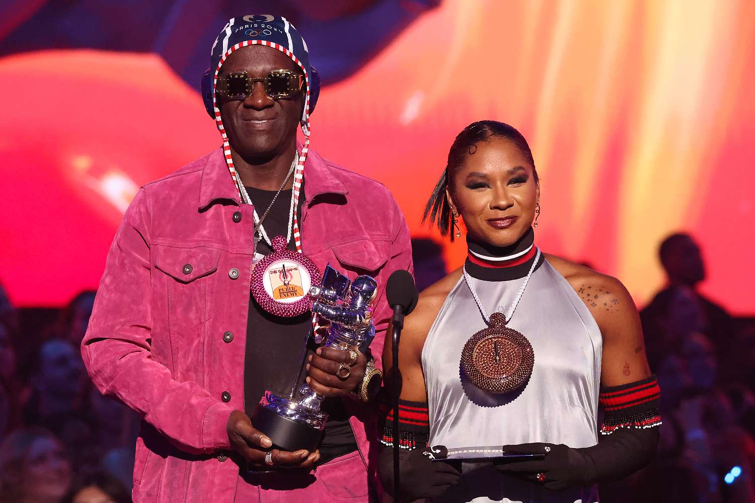 Flavor Flav and Jordan Chiles speak on stage during the 2024 MTV Video Music Awards at UBS Arena on September 11, 2024 in Elmont, New York.