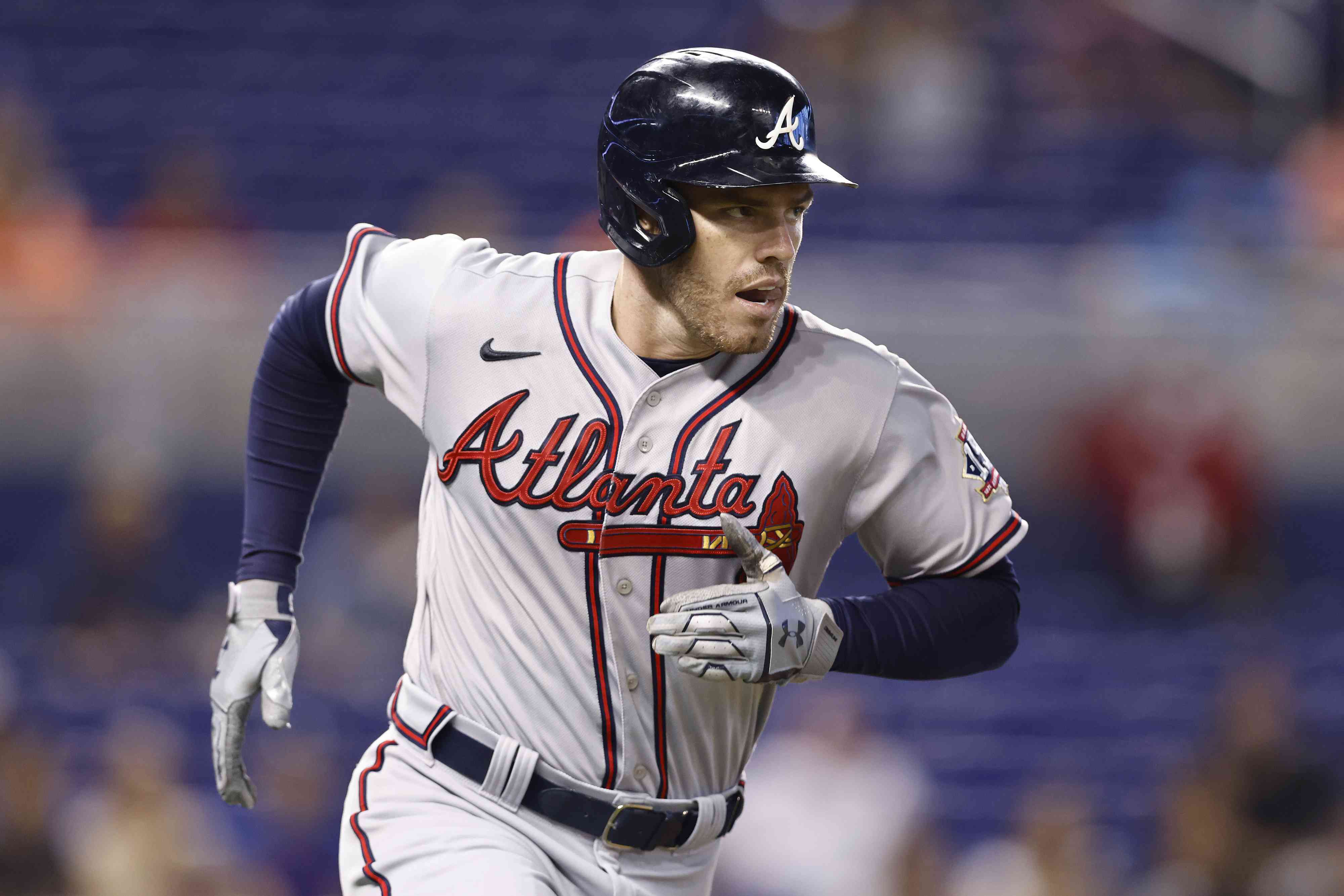 Freddie Freeman #5 of the Atlanta Braves watches his solo home run during the first inning off Anthony Bass #52 of the Miami Marlins at loanDepot park on July 09, 2021 in Miami, Florida. 