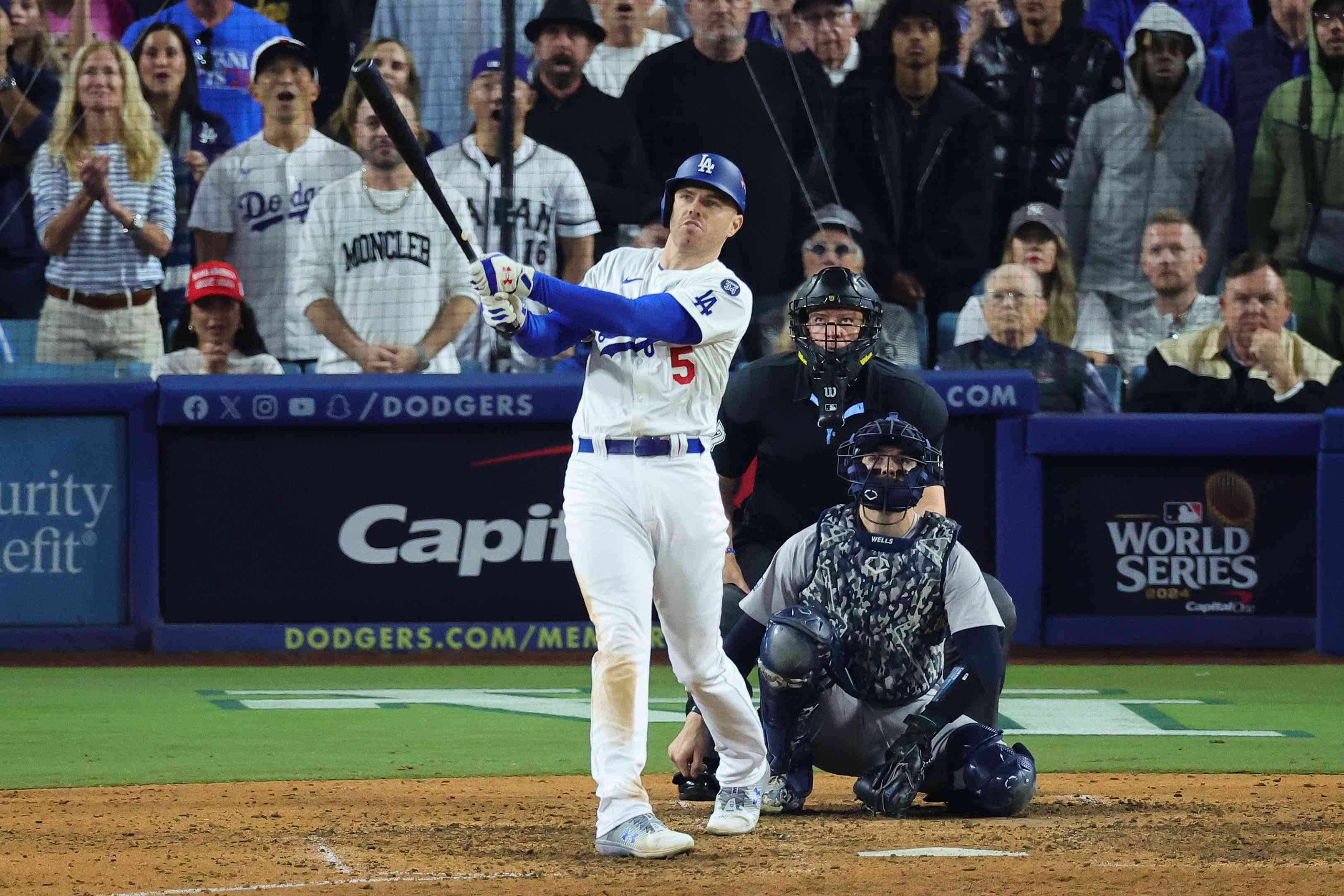 Freddie Freeman #5 of the Los Angeles Dodgers hits a walk-off grand slam during the tenth inning against the New York Yankees during Game One of the 2024 World Series at Dodger Stadium on October 25, 2024 in Los Angeles, California. 