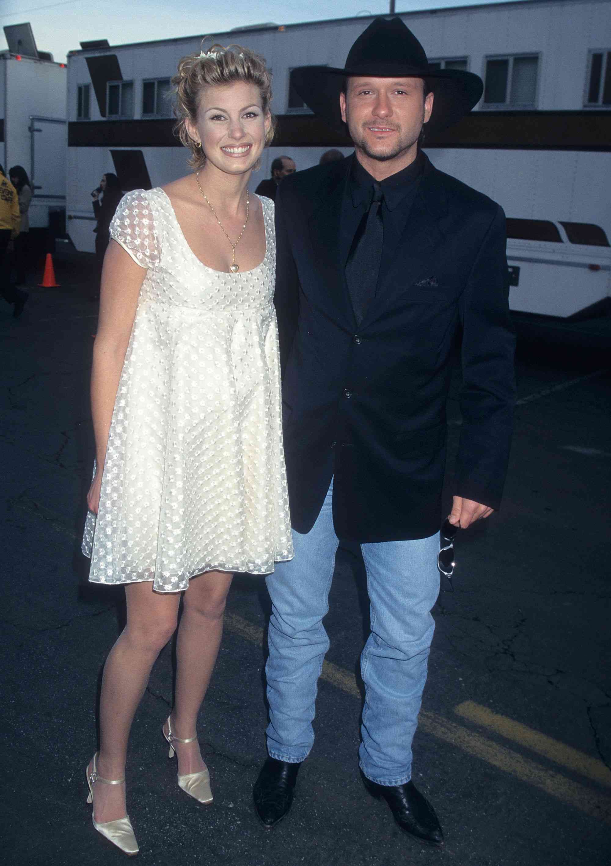 LOS ANGELES - JANUARY 27: Singer Faith Hill and singer Tim McGraw attend the 24th Annual American Music Awards on January 27, 1997 at the Shrine Auditorium in Los Angeles, California. (Photo by Ron Galella, Ltd./Ron Galella Collection via Getty Images) 