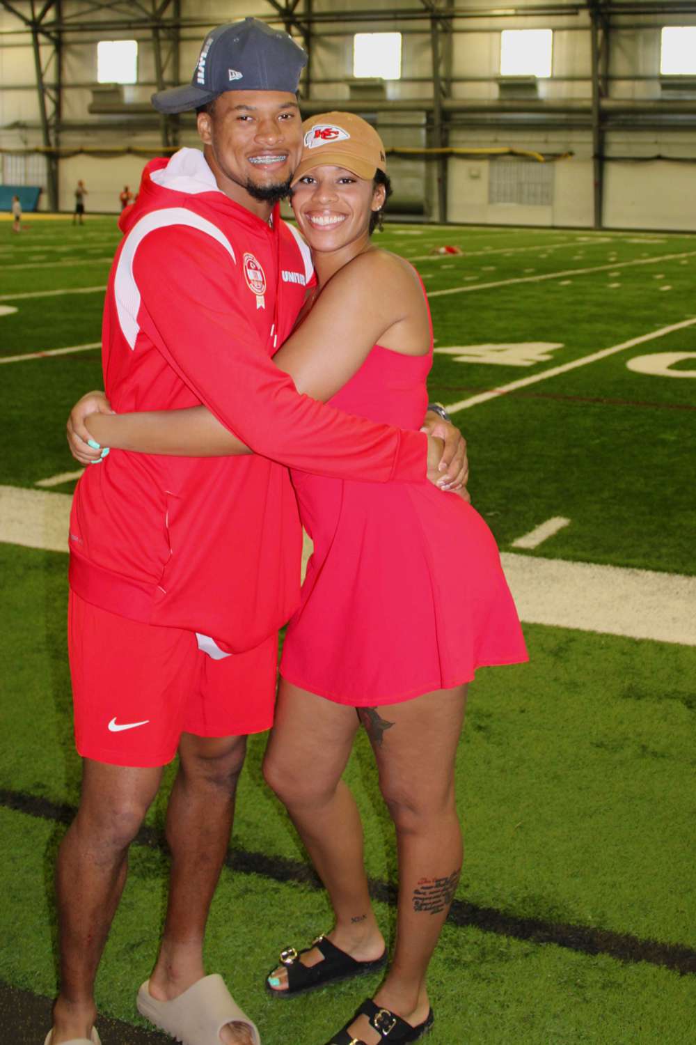 Jayla Thornton-Cook and Bryan Cook on football field