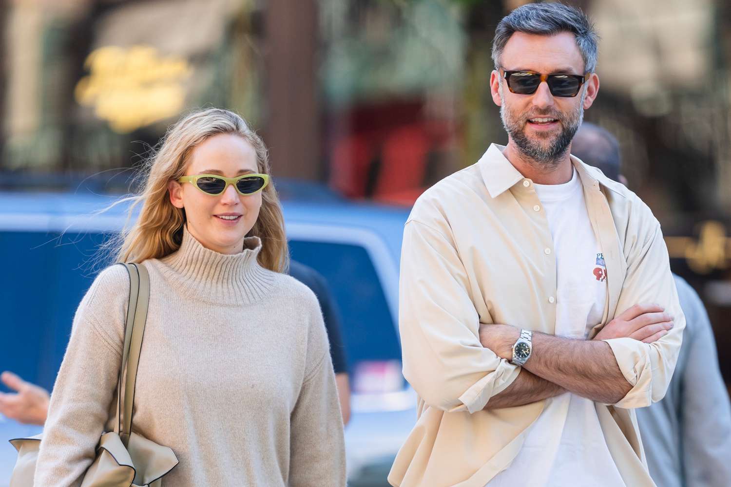 ennifer Lawrence and Cooke Maroney step out together in New York City. The 33 year old American actress was all smiles and dressed casually in a beige sweater paired with black trousers and furry orange slippers. Cooke kept things casual in a white tee shit under a button down shirt paired with brown trousers and Vans sneakers 