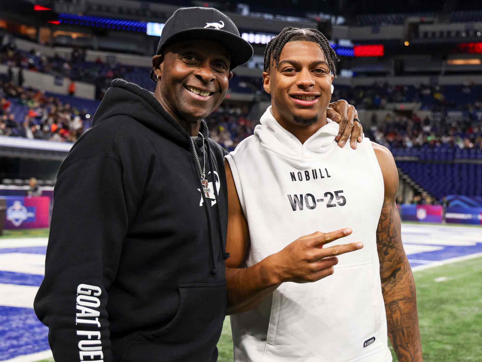 INDIANAPOLIS, INDIANA - MARCH 2: Jerry Rice poses for a picture with his son, Brenden Rice #WO25 of Southern California, during the NFL Scouting Combine at Lucas Oil Stadium on March 2, 2024 in Indianapolis, Indiana. (Photo by Kara Durrette/Getty Images)