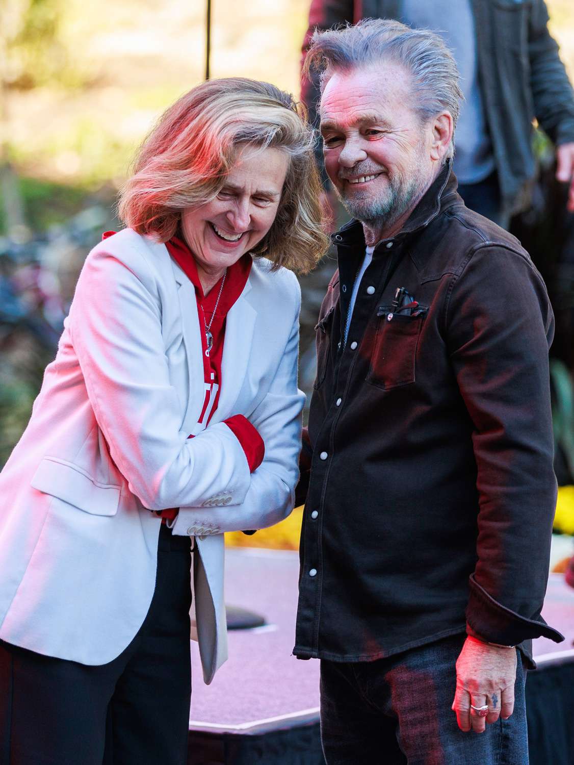 Rock star and singer-songwriter John Mellencamp (R) speaks with Indiana University President Pamela Whitten (L) after an unveiling ceremony for the bronze statue of himself at Indiana University. Hall of Fame singer-songwriter John Mellencamp now has a statue on the Indiana University Bloomington campus