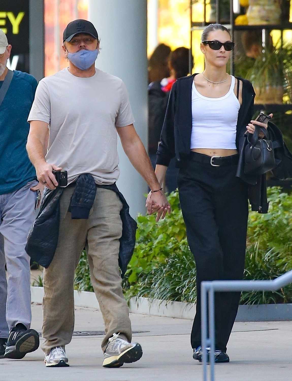 Leonardo DiCaprio .... hold hands with his model GF Vittoria Ceretti as they share some PDA during a NYC stroll this afternoon