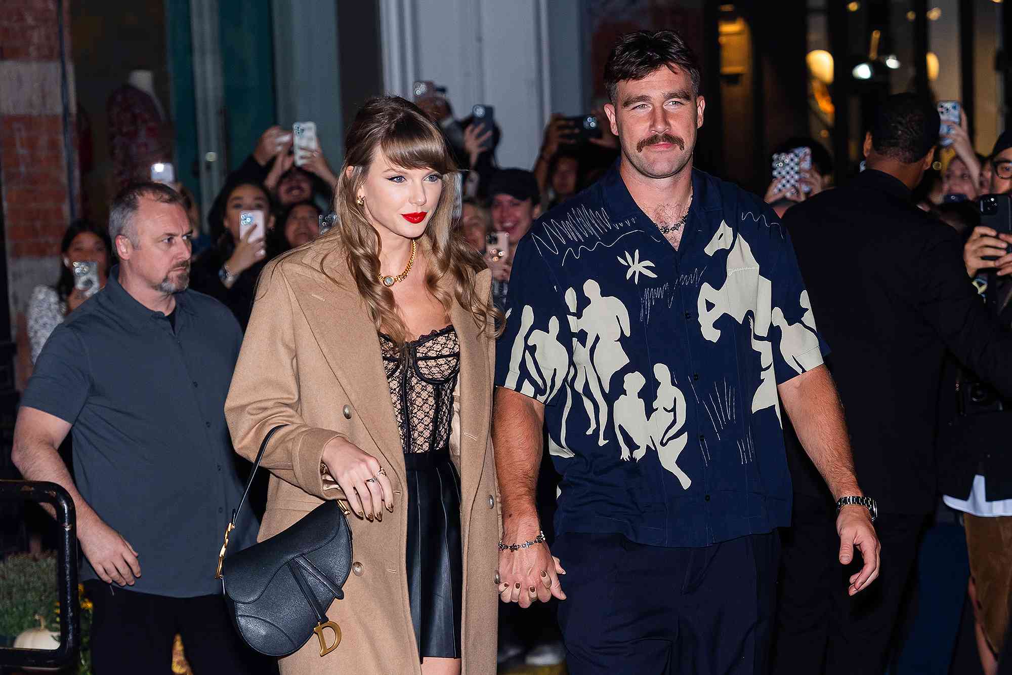 NEW YORK, NEW YORK - OCTOBER 11: Taylor Swift (L) and Travis Kelce are seen in SoHo on October 11, 2024 in New York City.