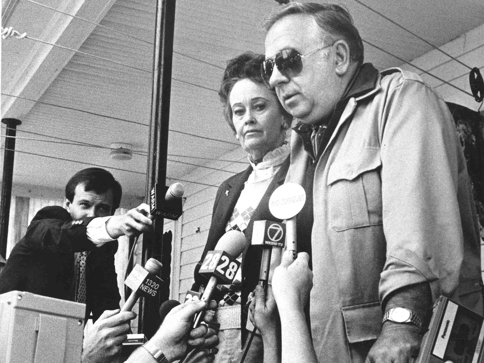 Lorraine and Ed Warren, described as demonologists of the New England Society for Psychic Research, address the press from West Pittston, Pa. home of Jack and Janet Smurl, Aug. 25, 1986. The pair say that the Smurl's home is infested with demons. The Smurl's claim they have suffered supernatural attacks for the past 18 months. (AP Photo/Wilkes-Barre Times Leader/Carolyn Bauman)