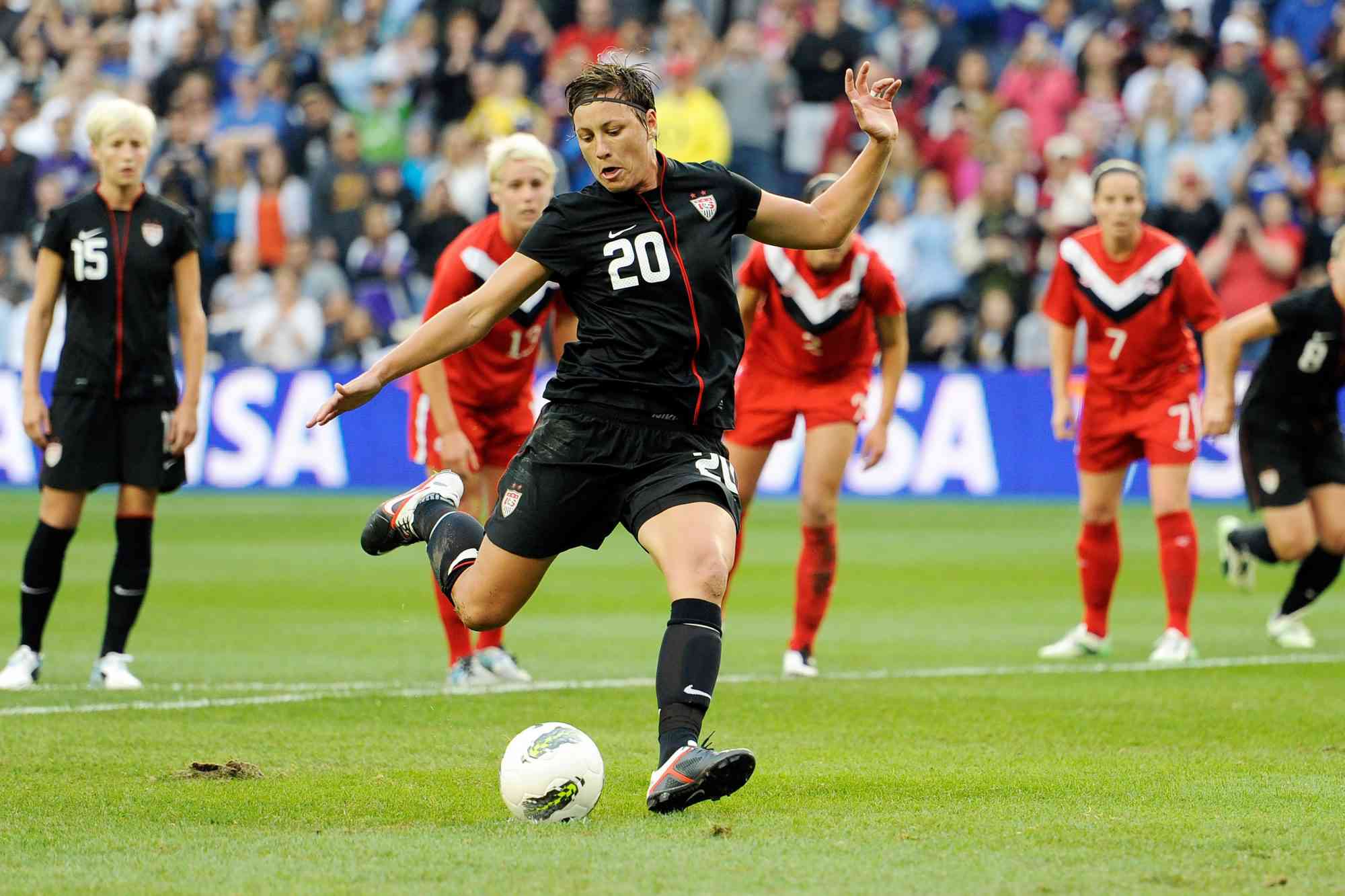 Forward Abby Wambach #20 of the United States scores on a penalty kick early in the first half against Canada on September 17, 2011 at LiveStrong Sporting Park in Kansas City, Kansas.