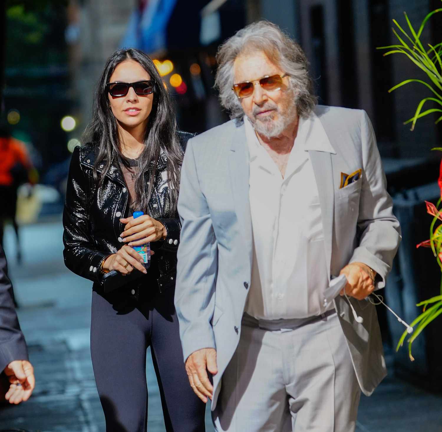 Noor Alfallah and Al Pacino arrive for a music video shoot with Bad Bunny on August 24, 2023 in New York City