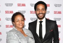 Andre Holland (R) and his mother attend the