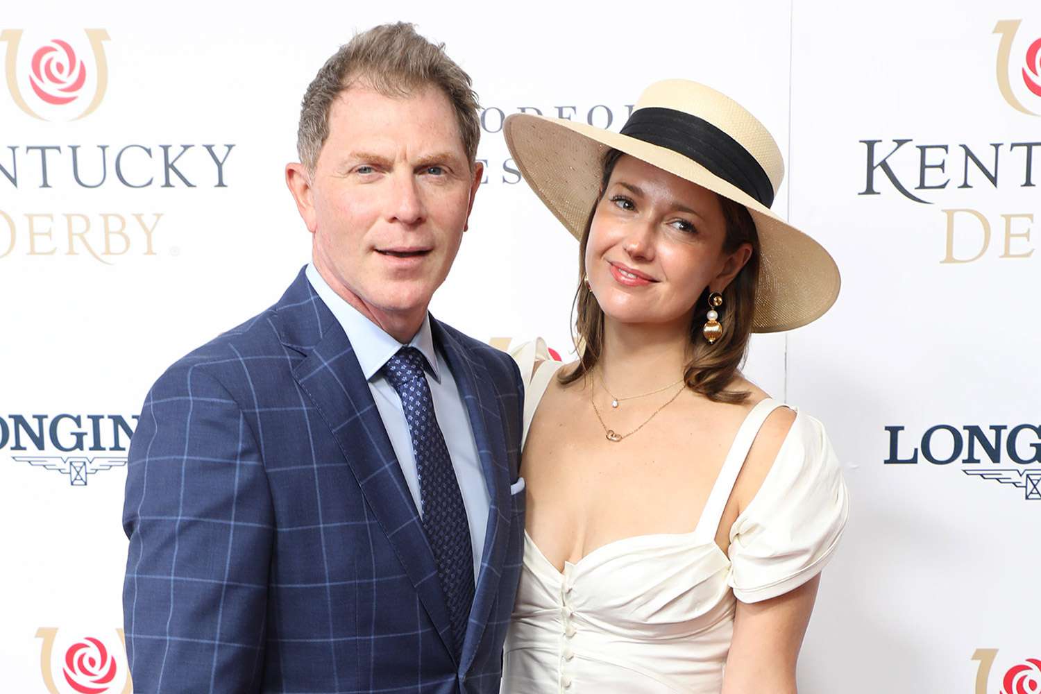 Bobby Flay and Christina Perez walk the red carpet at the 148th Kentucky Derby on May 07, 2022, at Churchill Downs in Louisville, KY