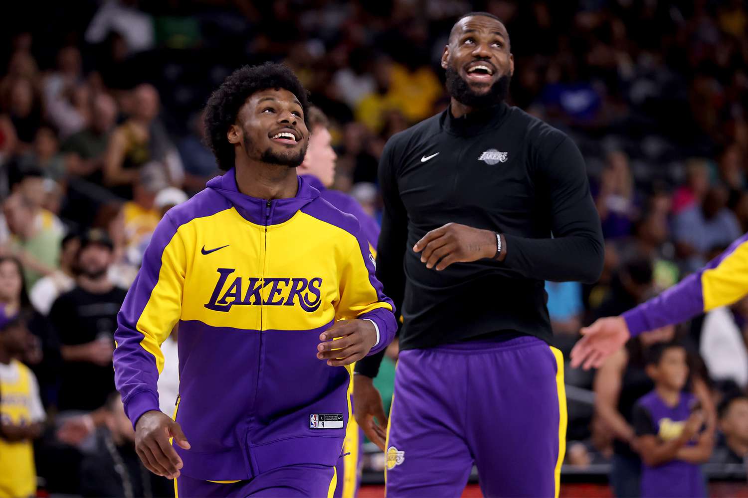 Bronny James #9 and LeBron James #23 of the Los Angeles Lakers warm up prior to the game against the Phoenix Suns at Acrisure Arena on October 06, 2024 in Palm Springs