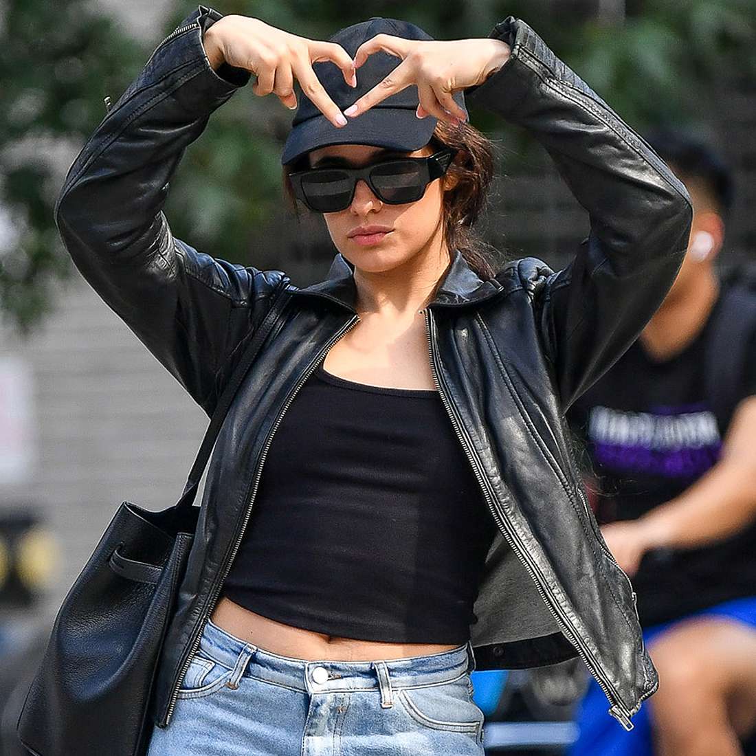 Camila Cabello strikes a pose while out with her parents in New York City