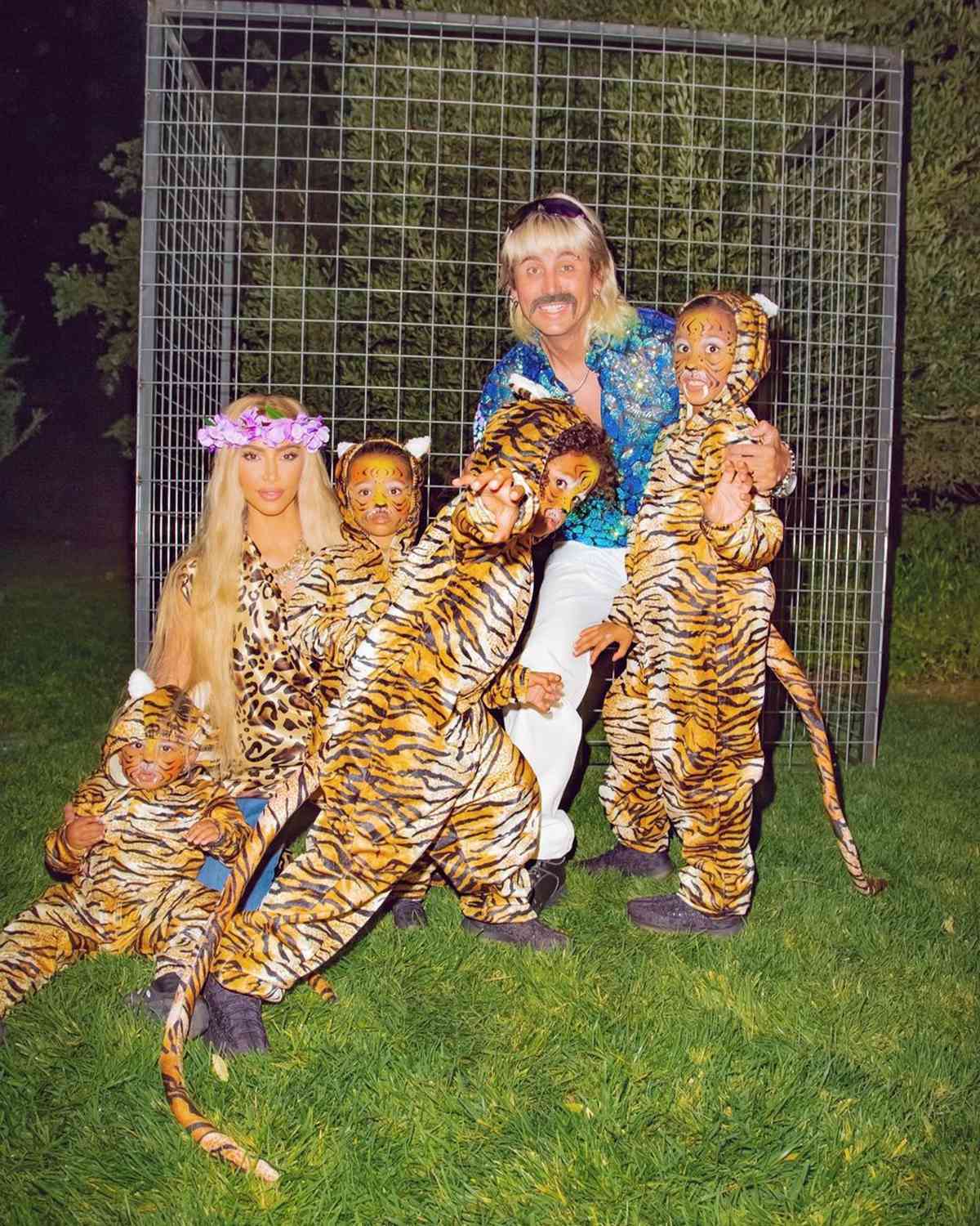 From left to right: Psalm West, Kim Kardashian, Chicago West, Psalm West, Jonathan Cheban and North West pose outside in 'Tiger King'-inspired costumes