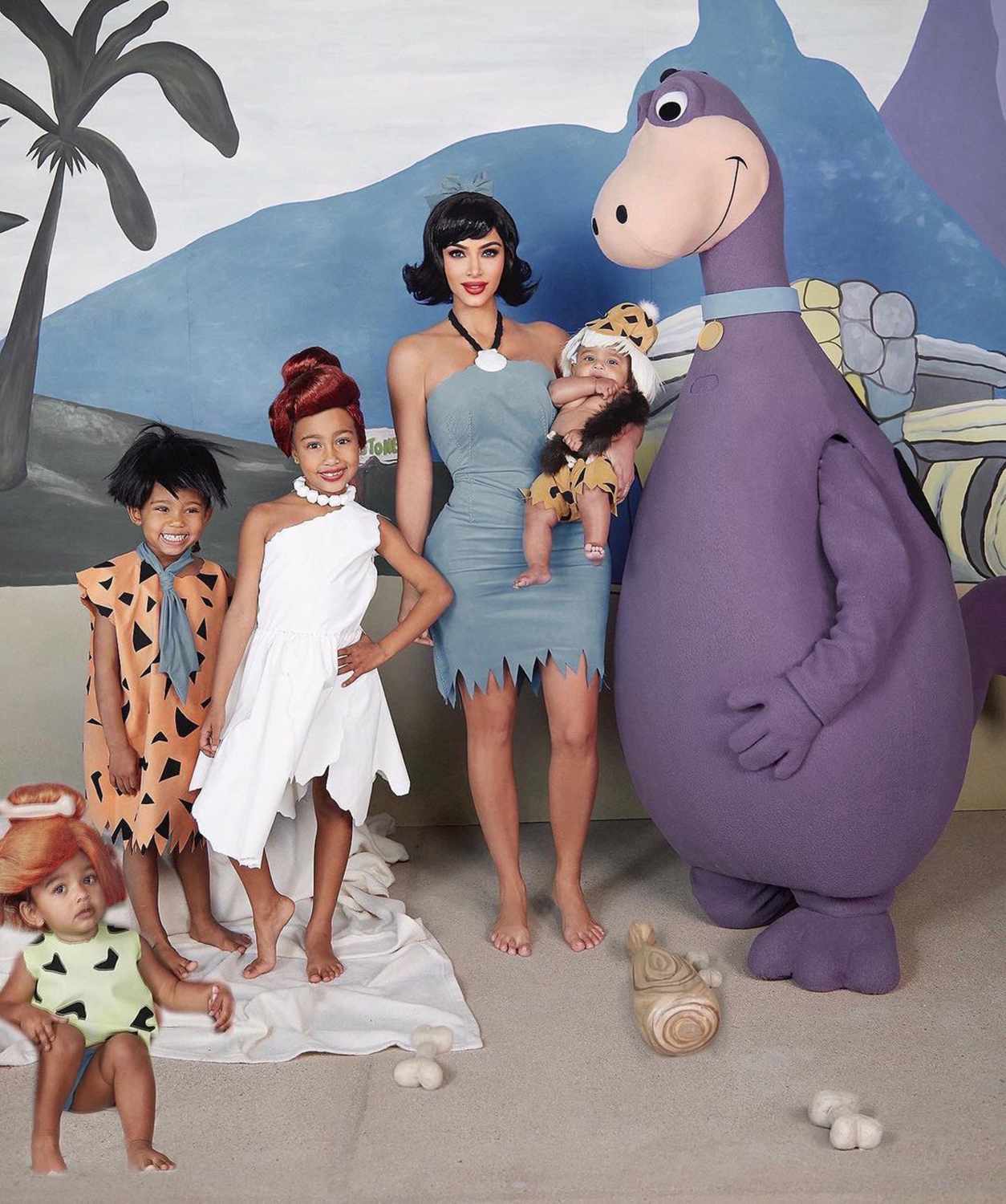 From left to right: Saint West, North West, Kim Kardashian, Chicago West and Kanye West dressed as the Flinstones in 2019